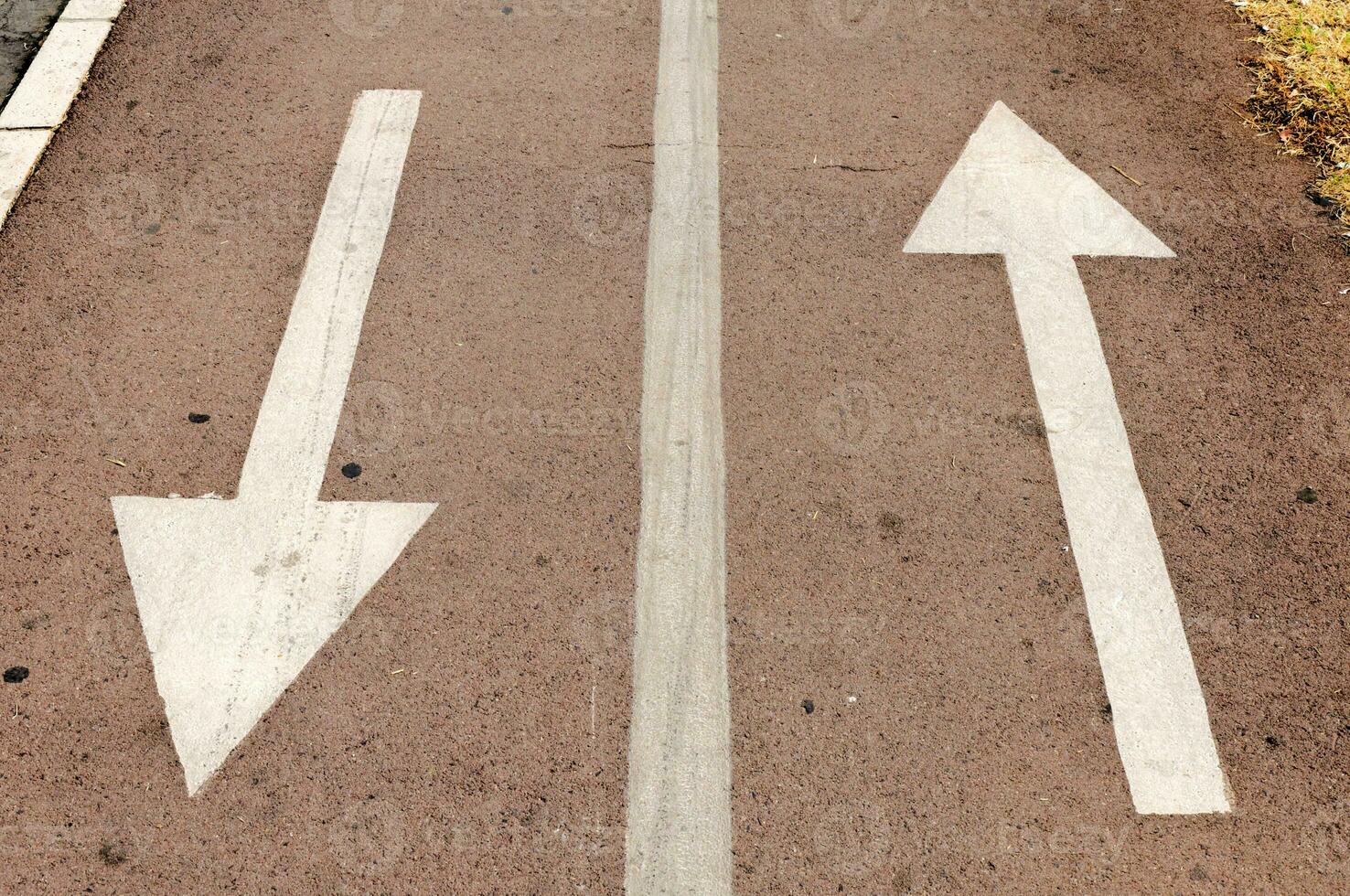 Arrows sign on the road photo