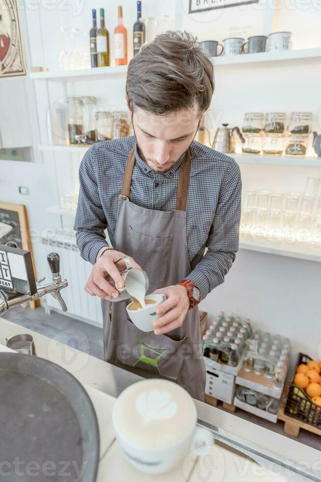 Barista in the coffee shop photo