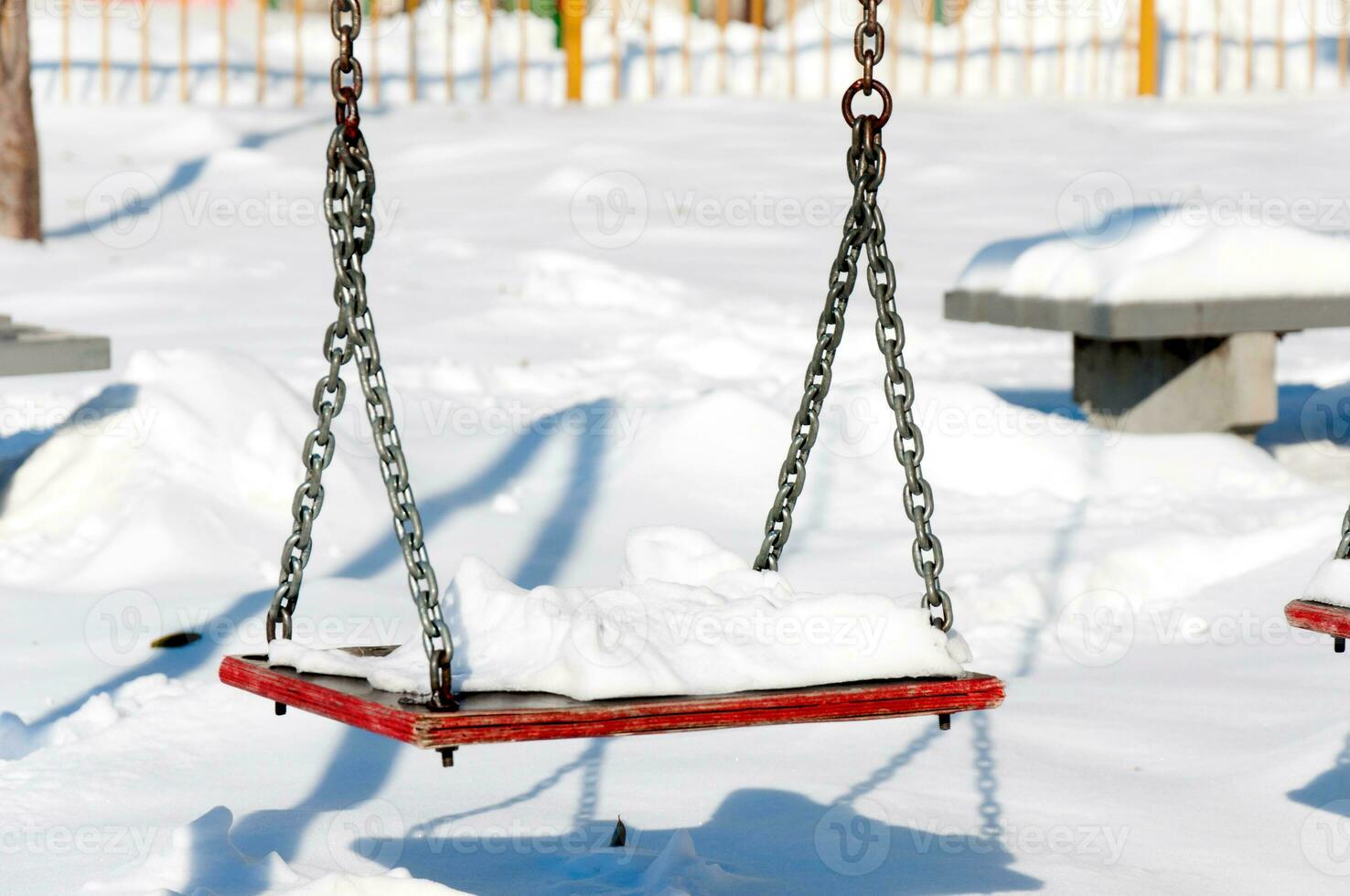 Winter and snow on swing photo