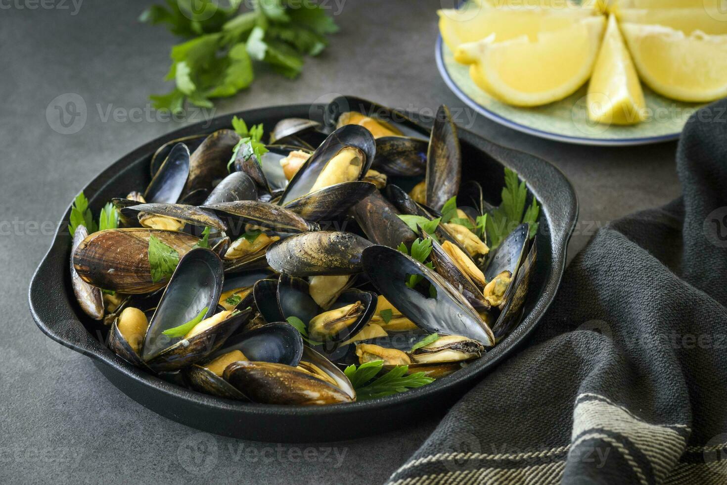 Cooked mussels with lemon photo