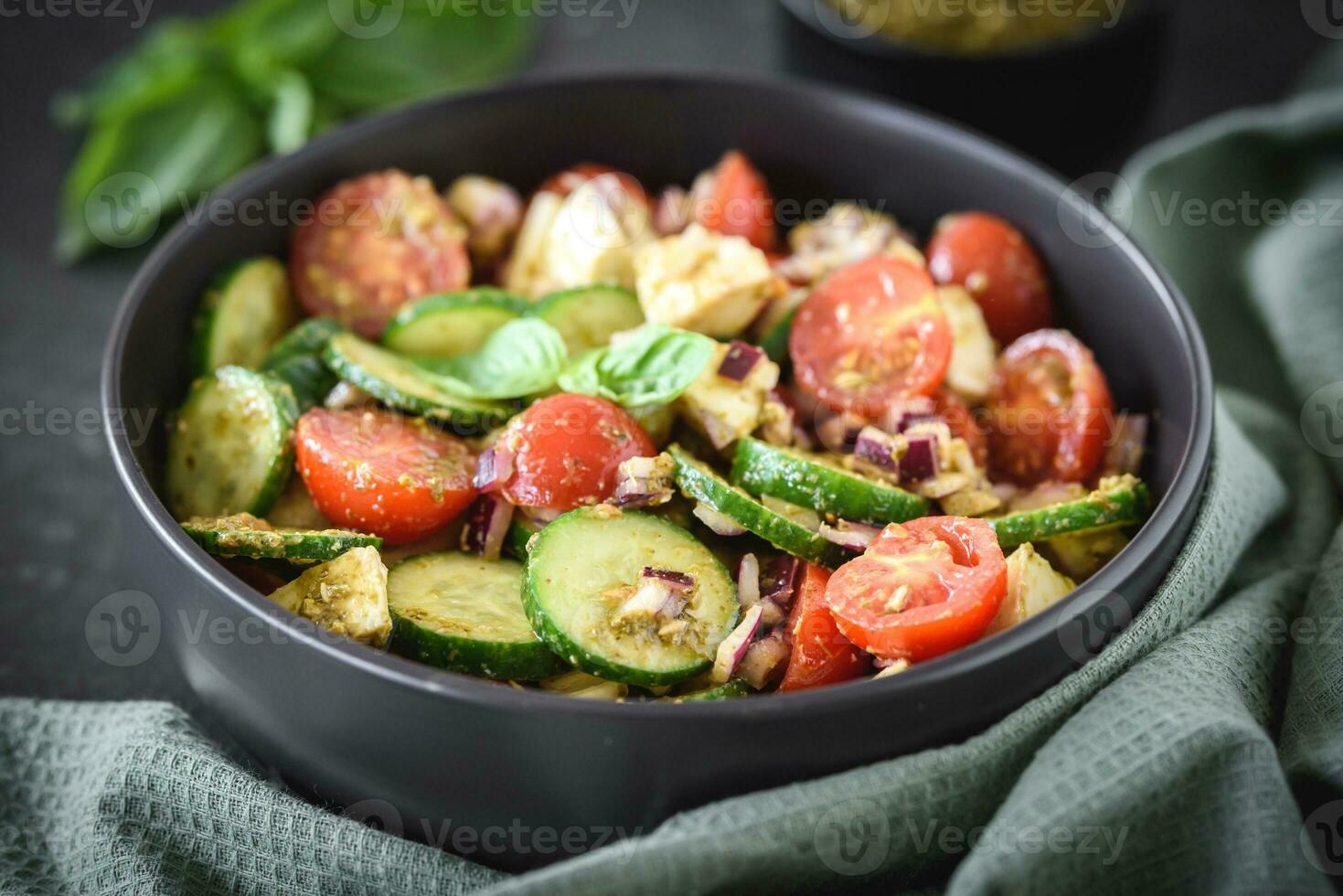 Pesto cucumber tomato salad 23300780 Stock Photo at Vecteezy