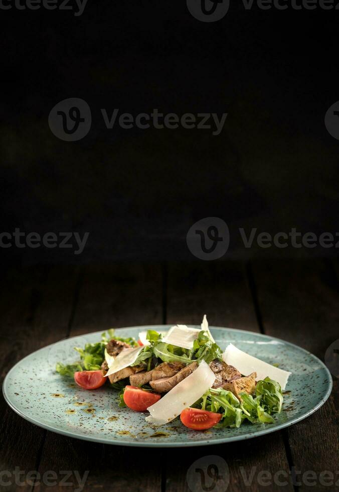 Served food on black background photo