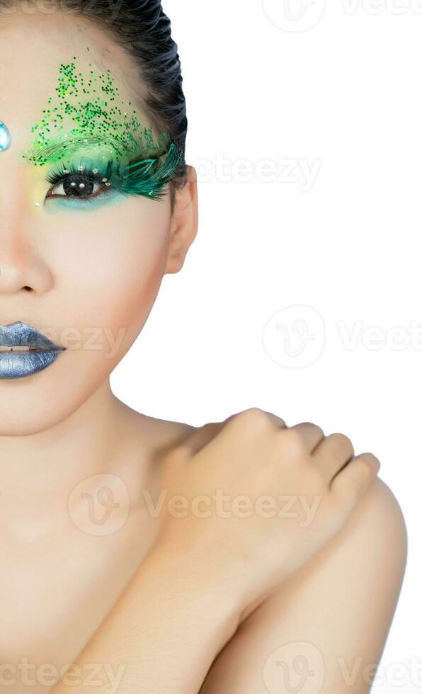 beautiful women with perfect art make up and long false eyelashes made from feathers photo