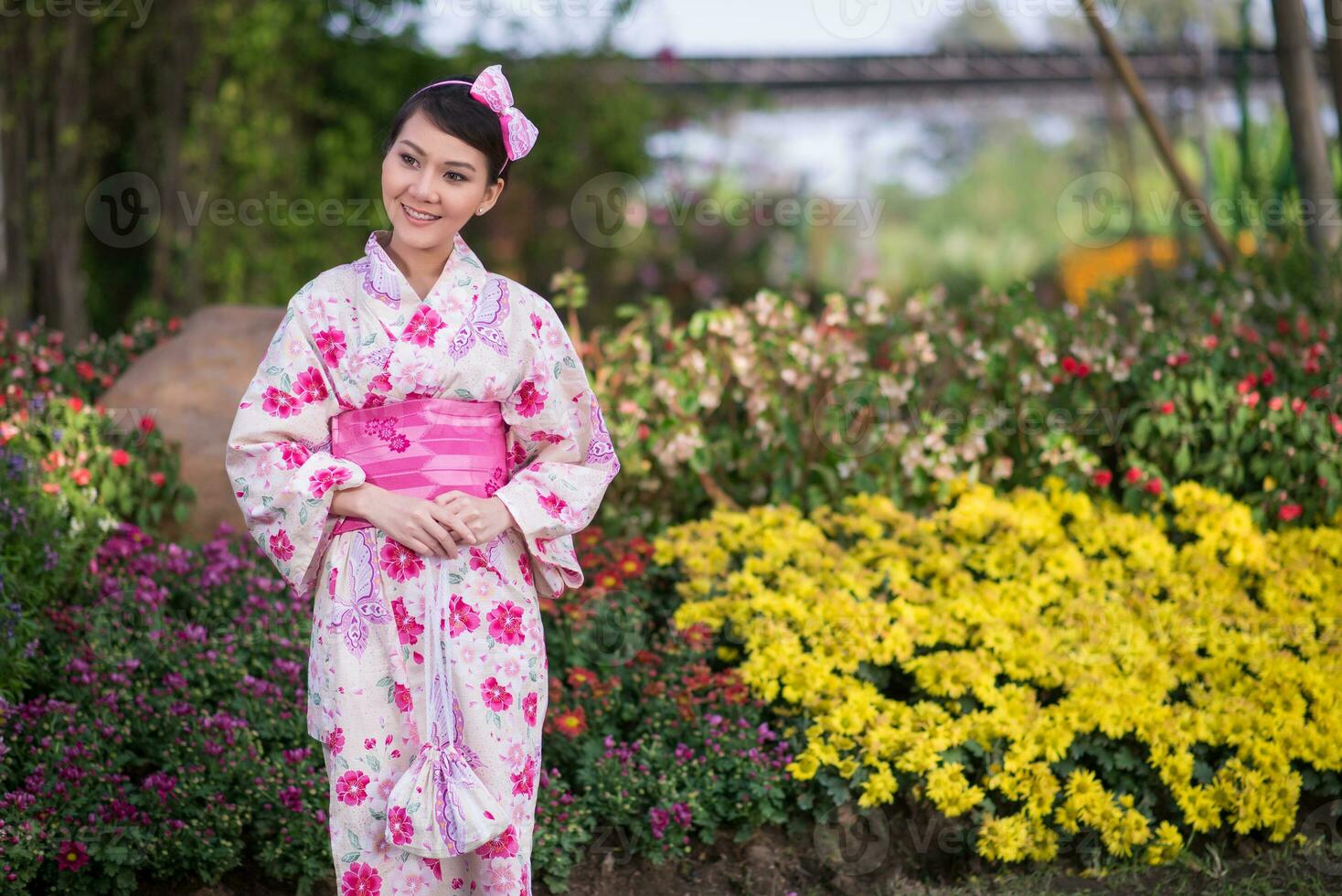 Beautiful young woman wearing japanese traditional Yukata photo