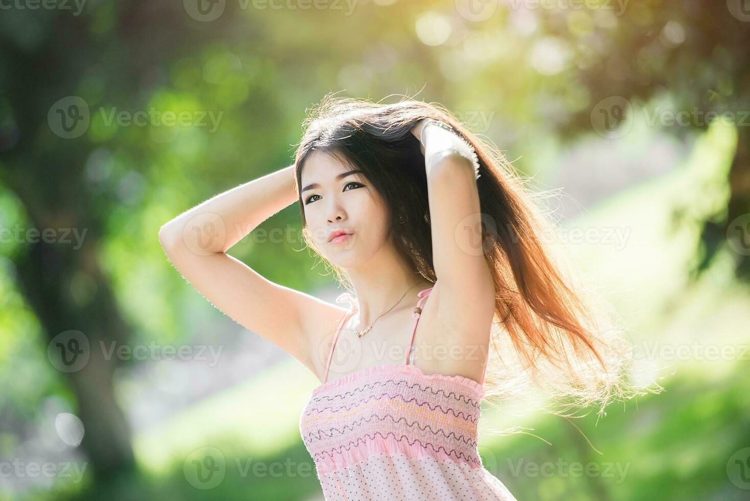 pretty girl in the park with sunshine day photo