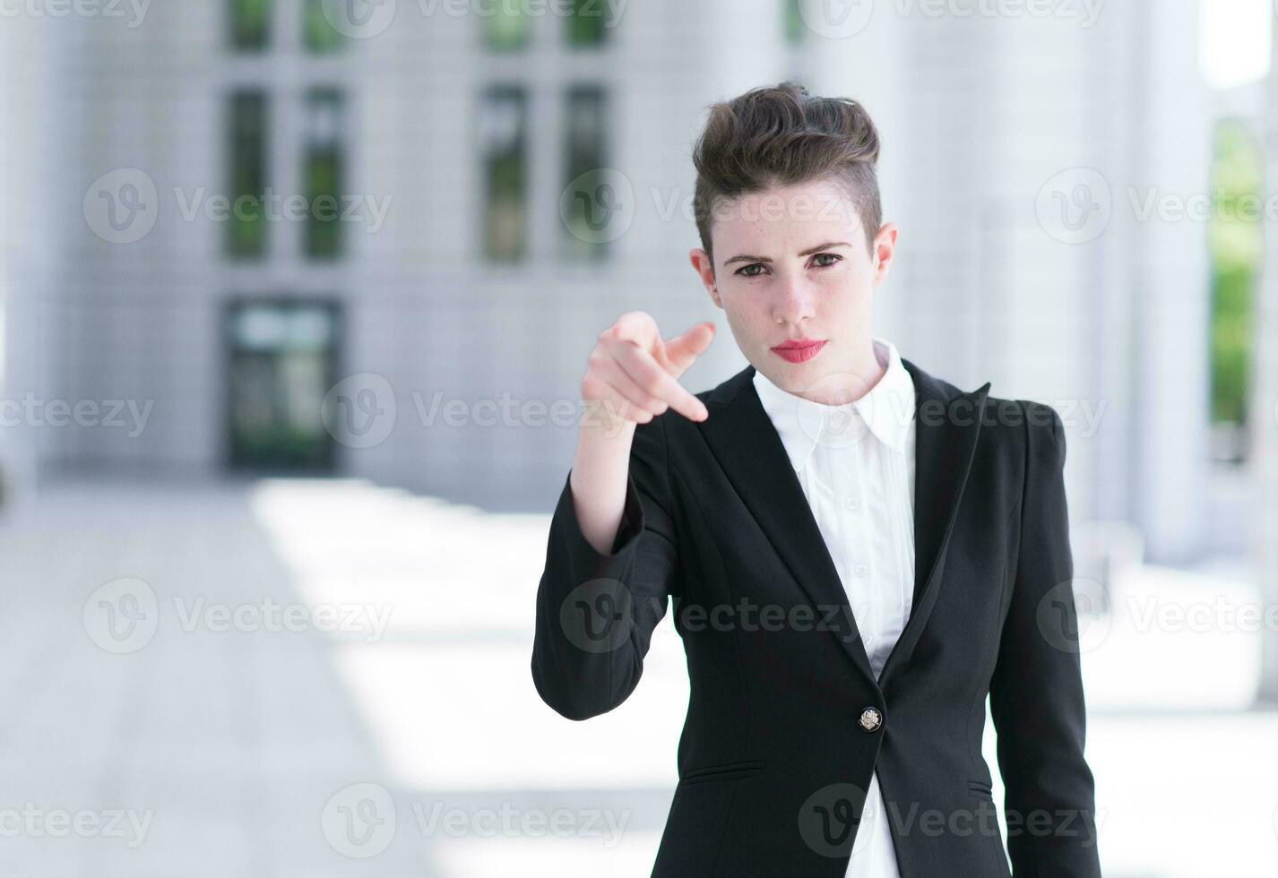 Modern business woman pointing photo