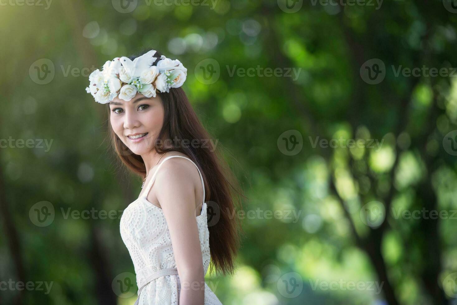 pretty Asian girl with birds crown photo