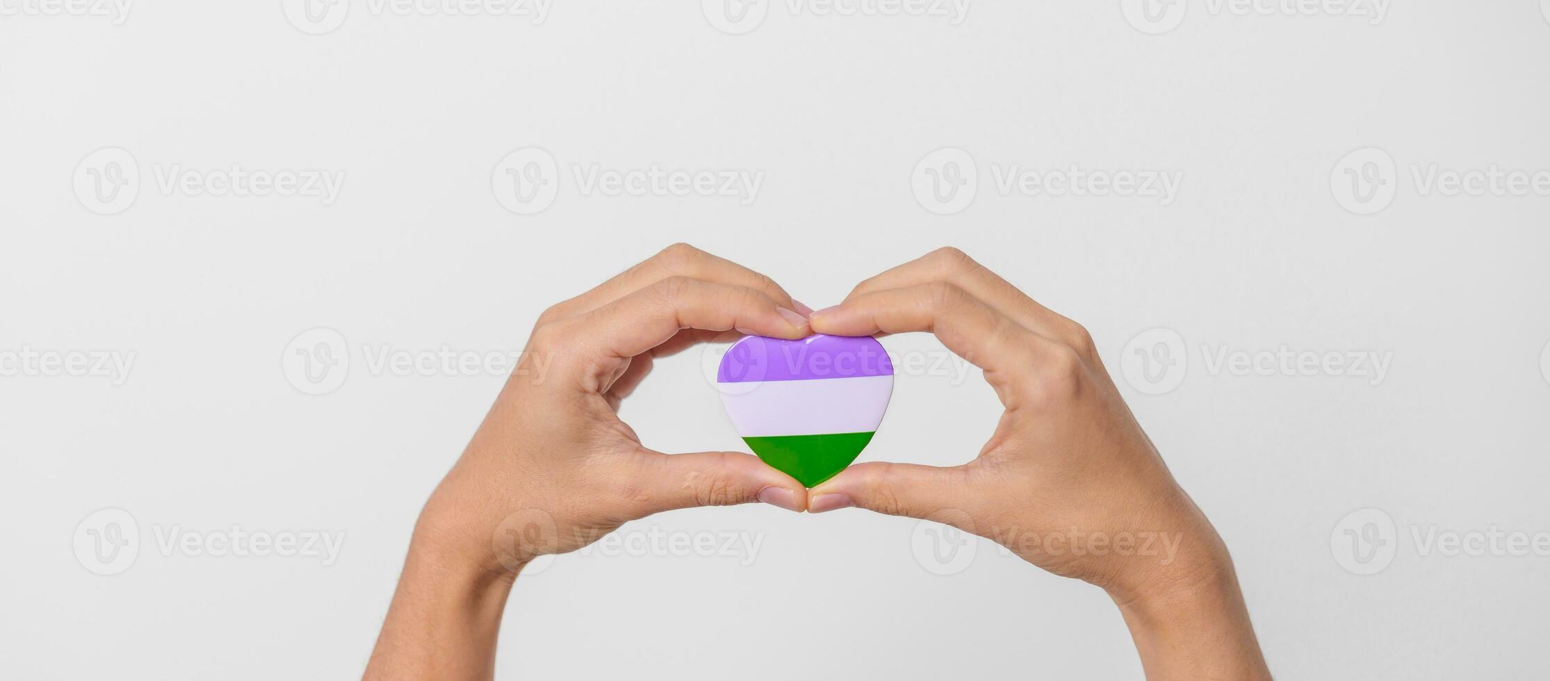 Queer Pride Day and LGBT pride month concept. purple, white and green heart shape for Lesbian, Gay, Bisexual, Transgender, genderqueer and Pansexual community photo