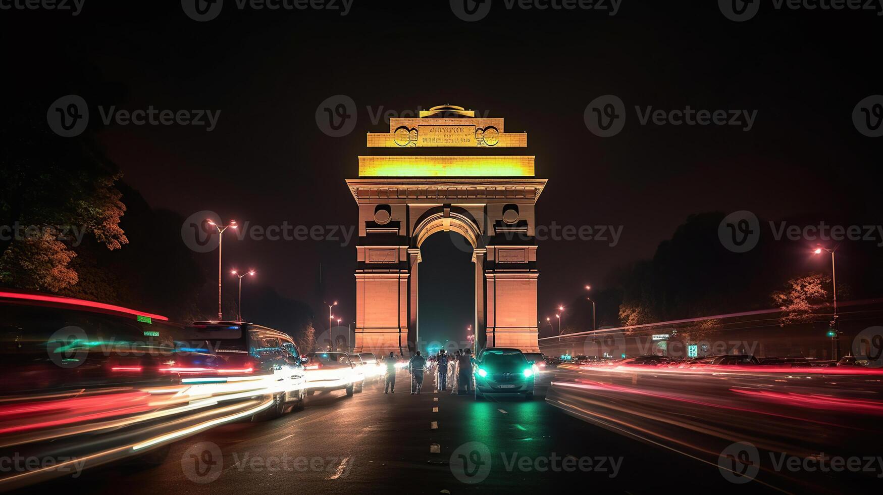 India gate at night with multicolored lights. This landmark is one of the main attractions of Delhi and a popular tourist destination. photo