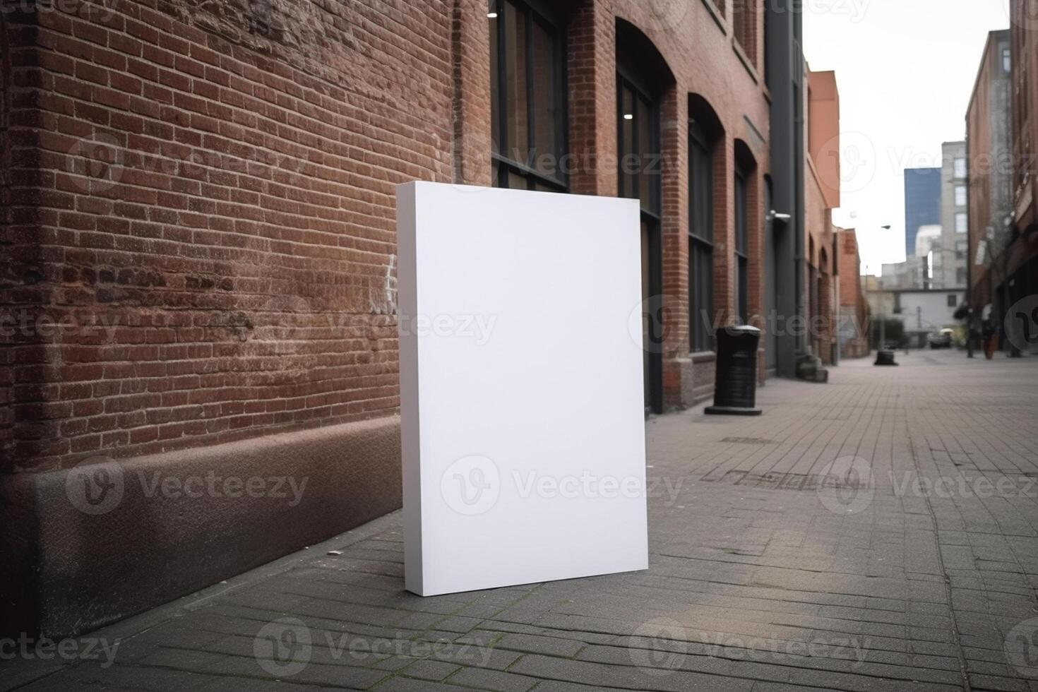 A blank white billboard mockup on a sidewalk in a city photo