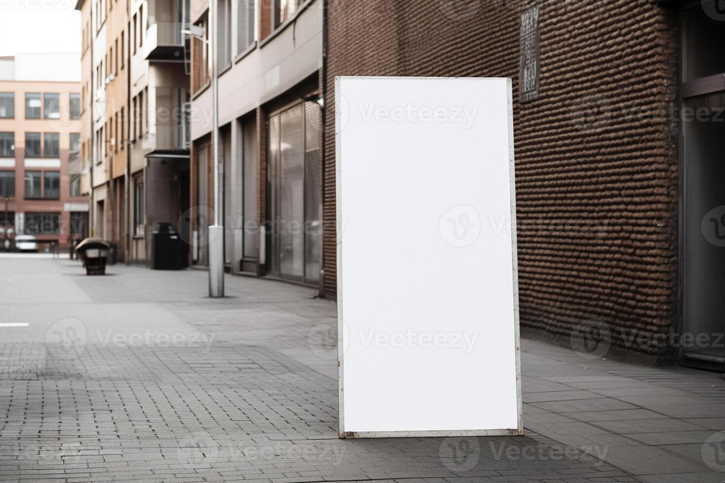 A blank white billboard mockup on a sidewalk in a city photo