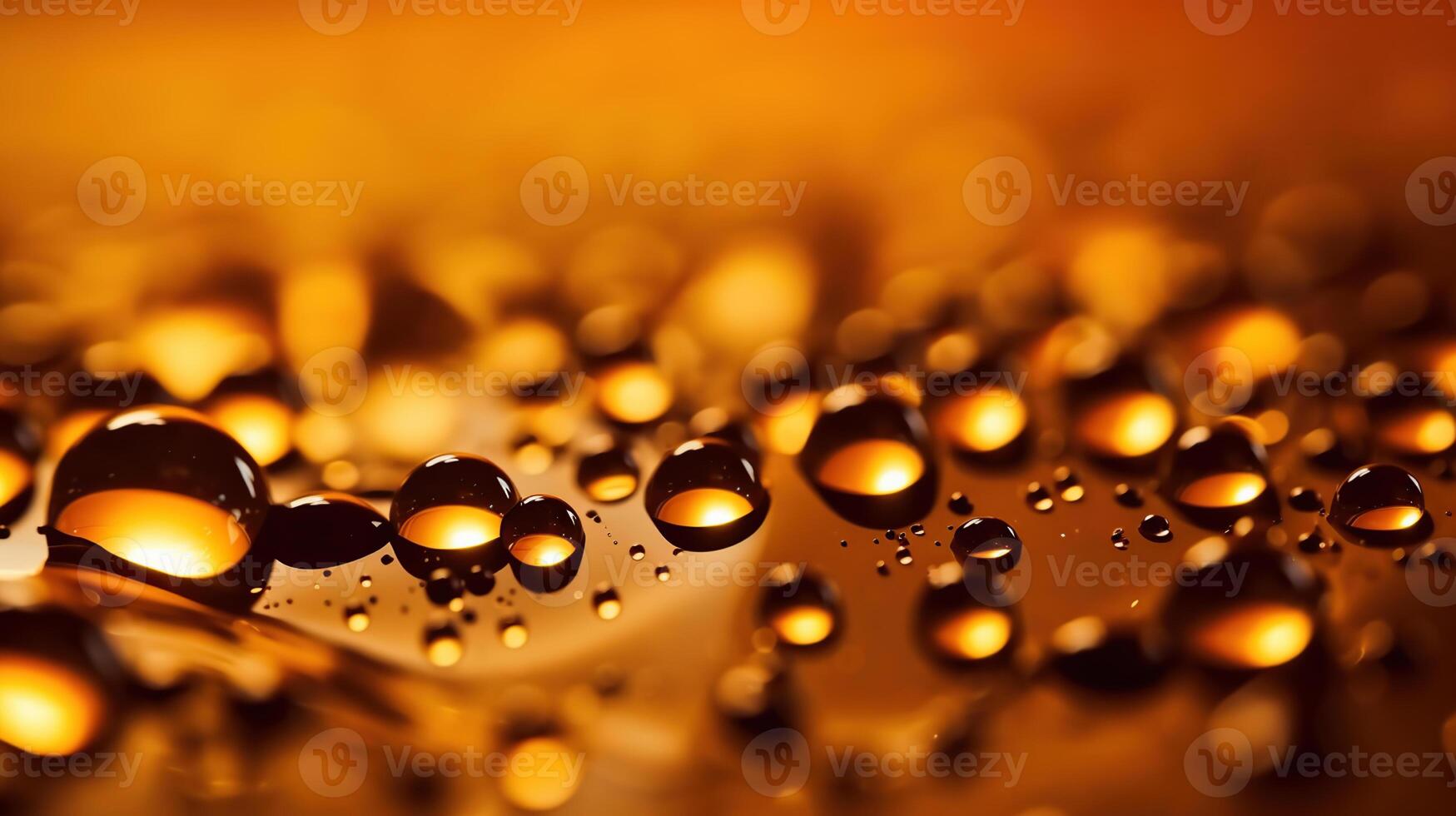 Golden drops of oil or serum surface background, photo