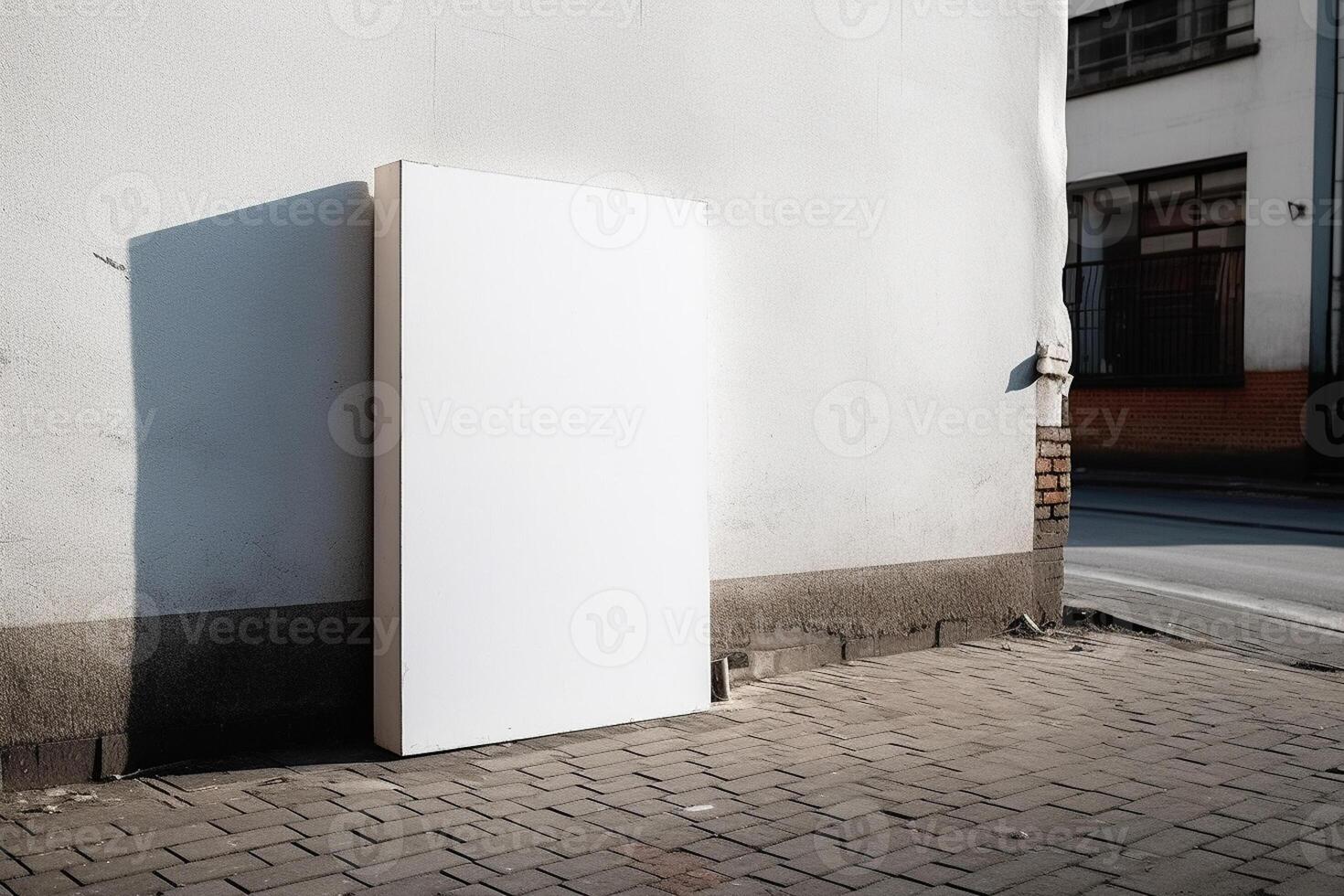 A blank white billboard mockup on a sidewalk in a city photo