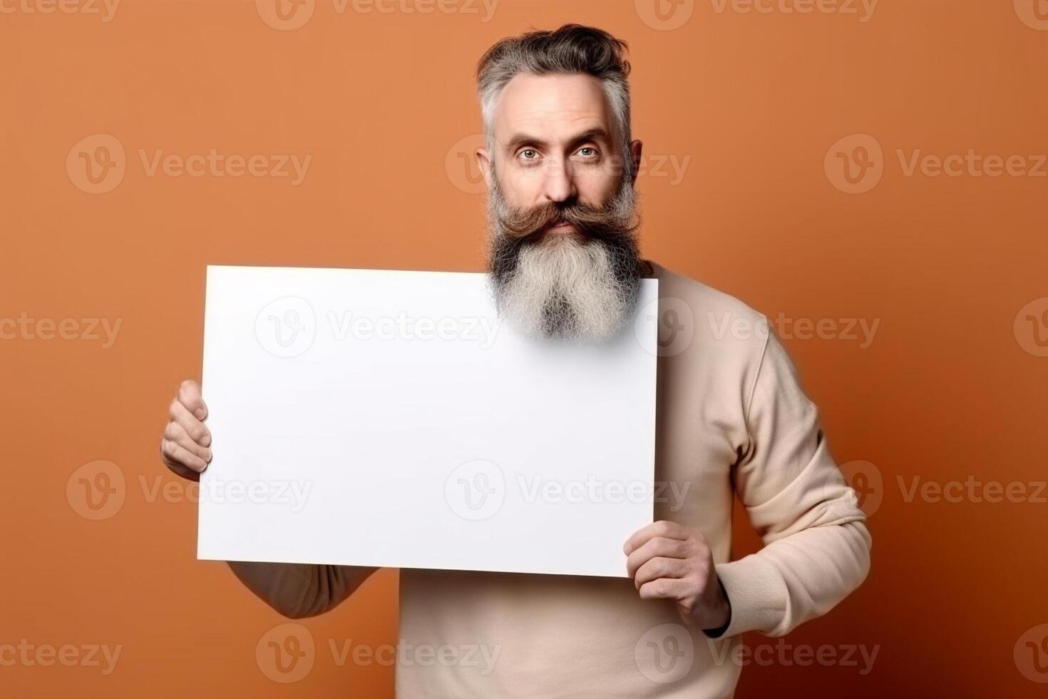 A man holds a blank white sign board mockup in his hand photo