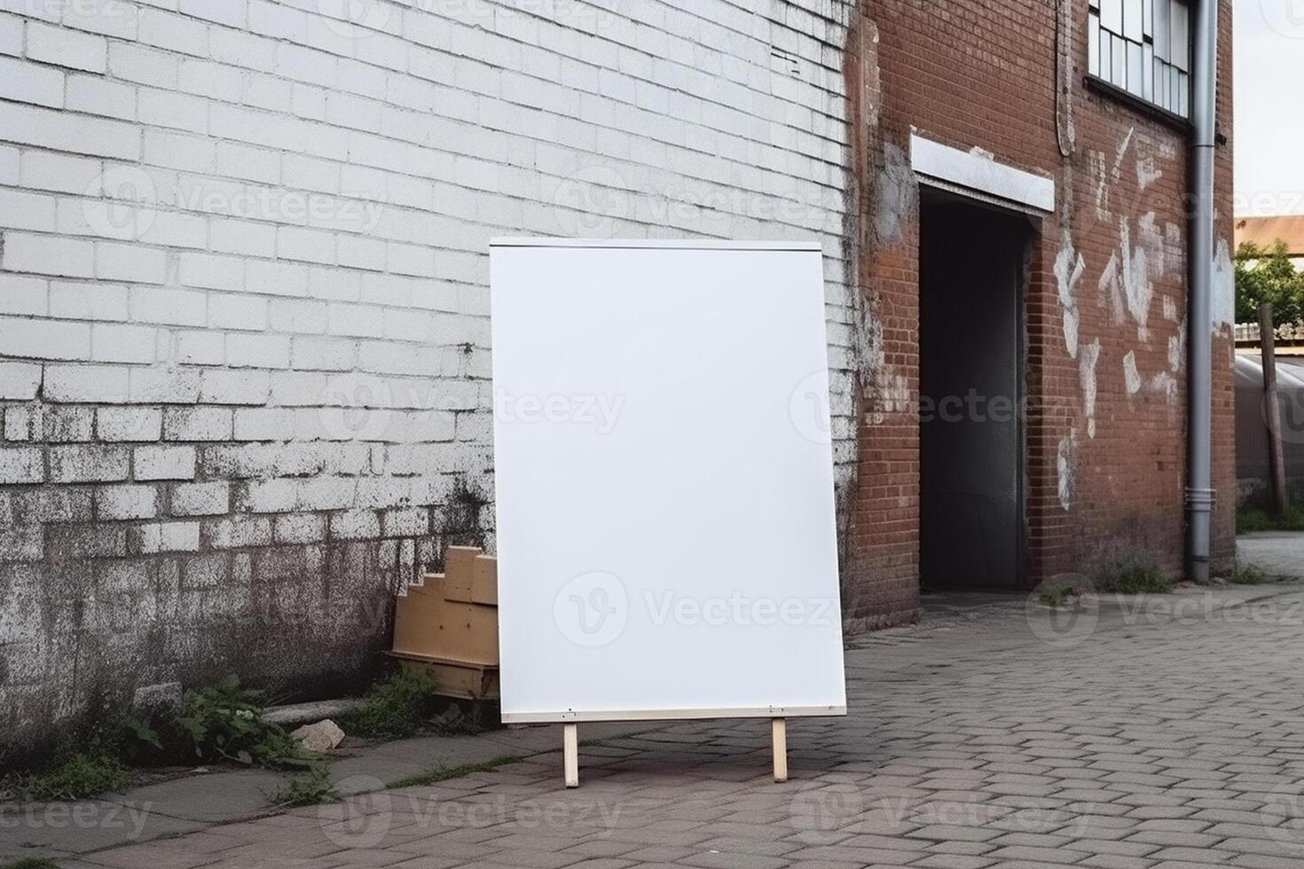 A blank white billboard mockup on a sidewalk in a city photo