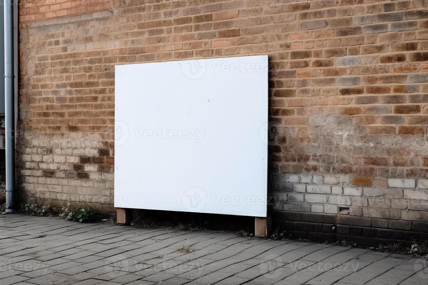 A blank white billboard mockup on a sidewalk in a city photo
