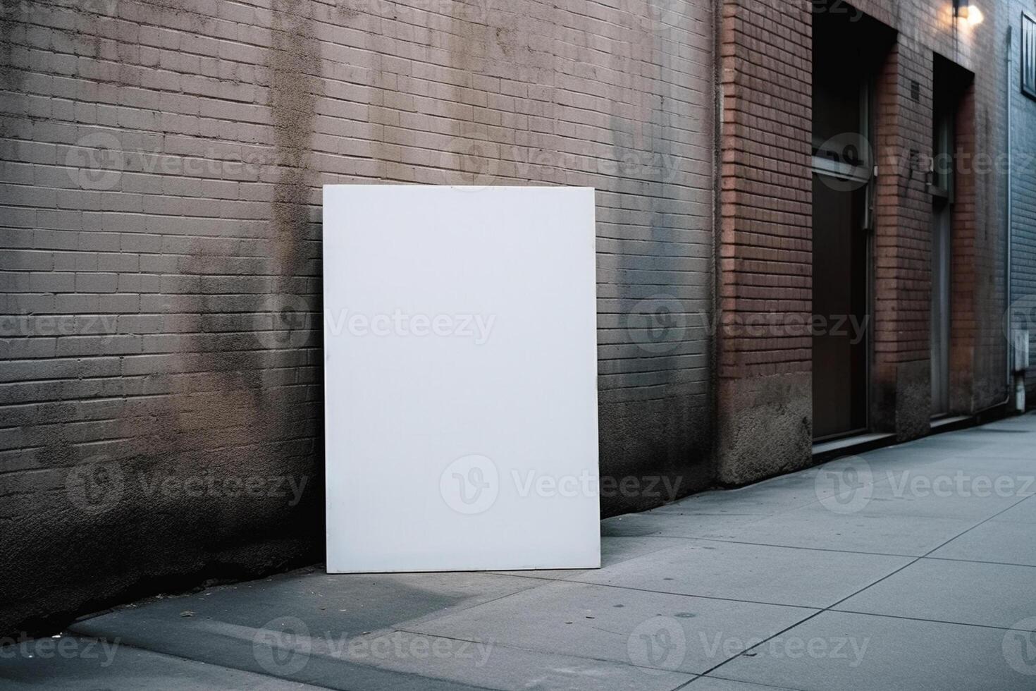 A blank white billboard mockup on a sidewalk in a city photo