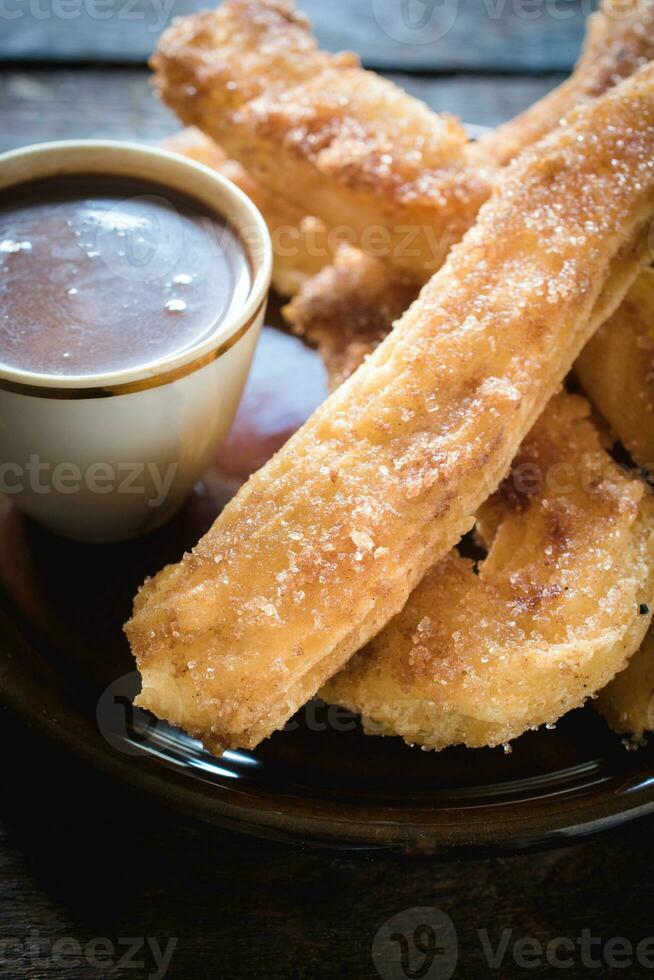 Spanish churros with chocolate photo