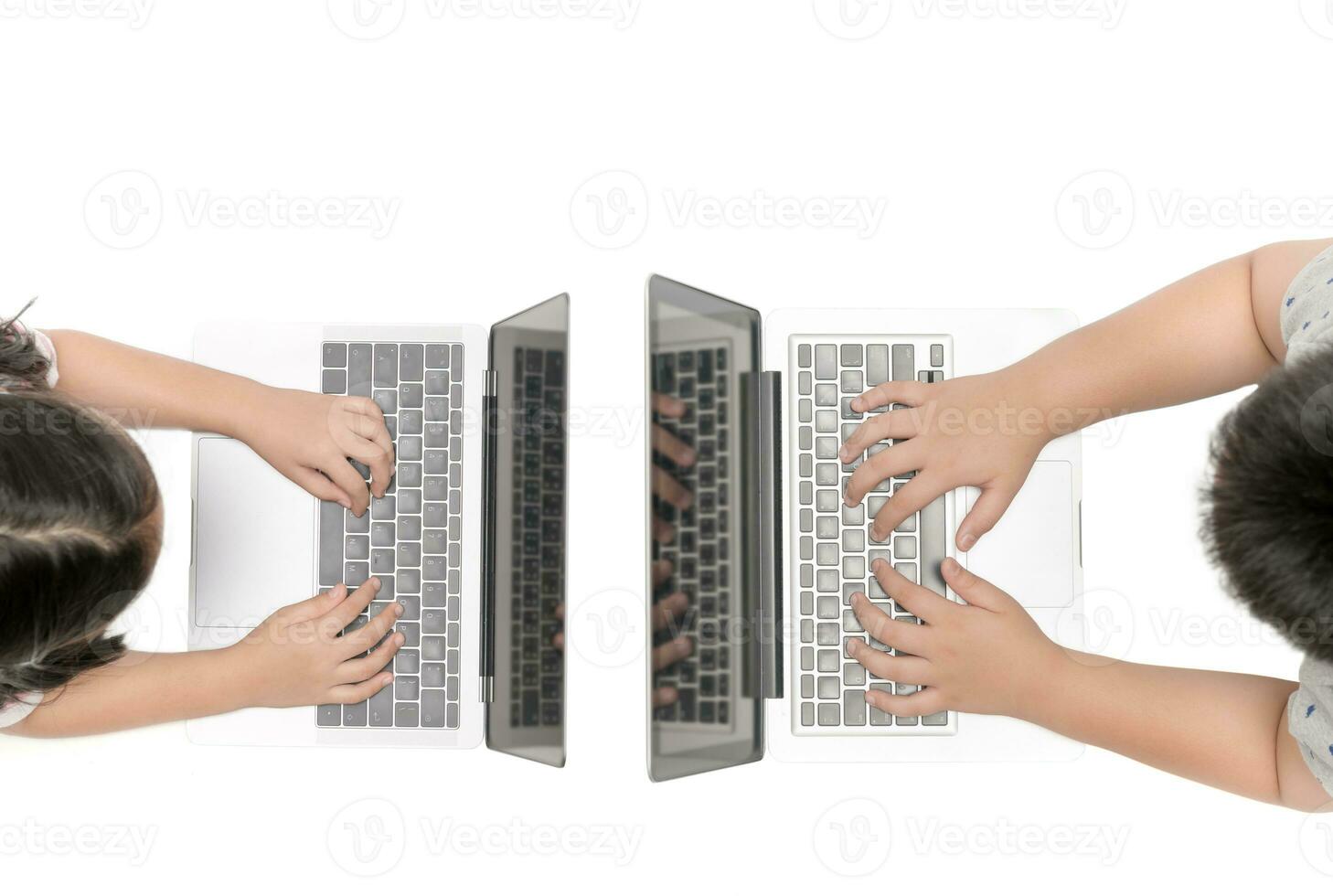 hand child playing computer on top view photo