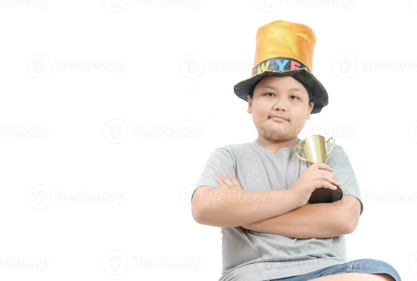 Obese fat child holding golden winning cup isolated photo