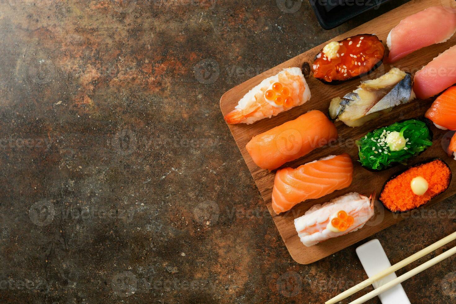 close up of sashimi sushi set with chopsticks photo