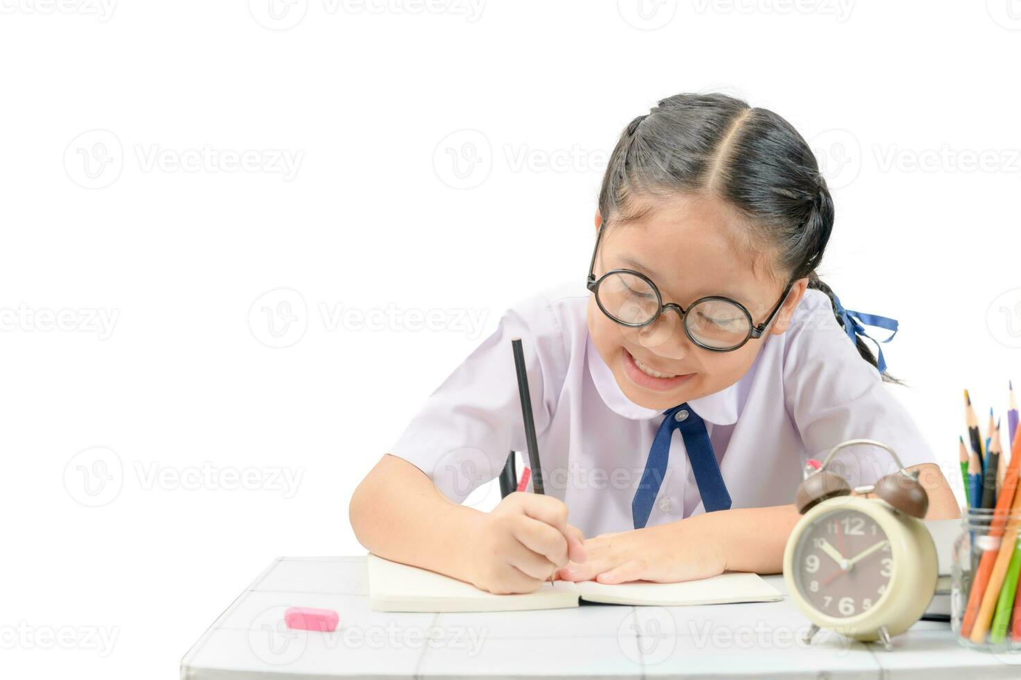 Cute asian student doing homework photo