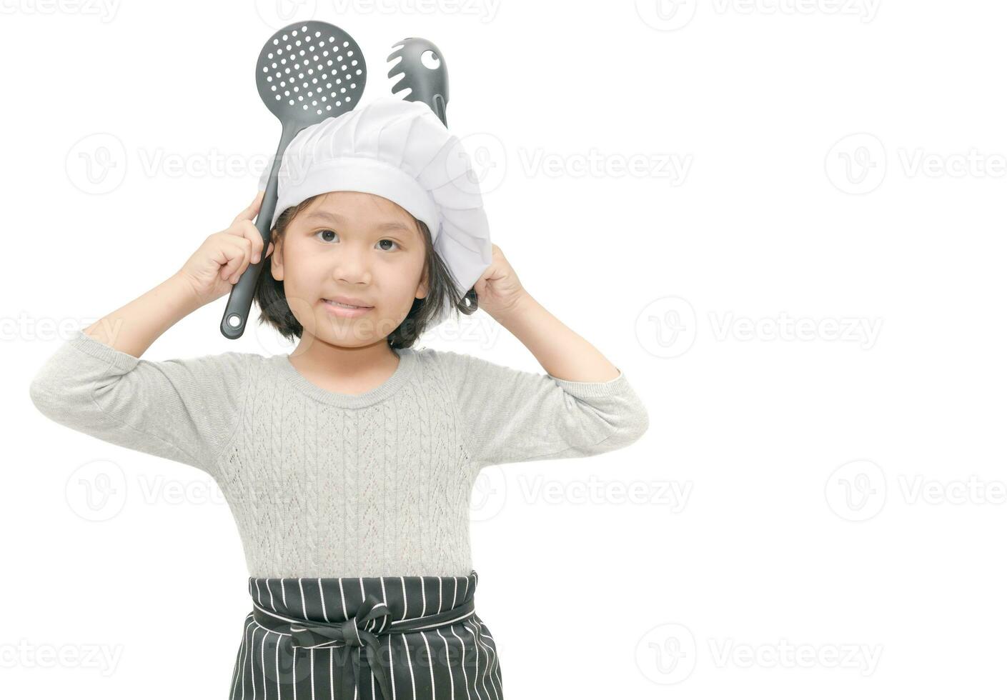 Portrait of cute girl chef with cook hat and apron photo