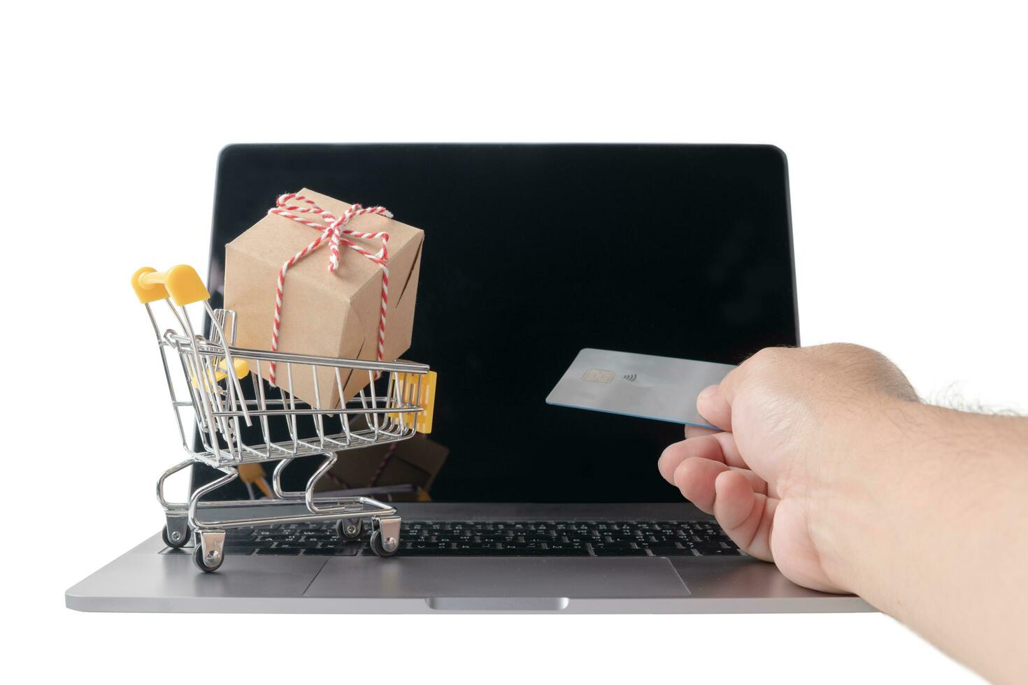 Man holding credit card    and Boxes in a trolley photo