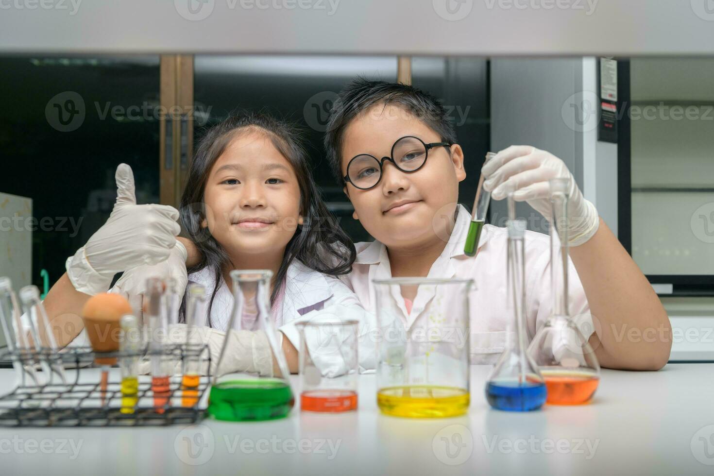 Happy two children making science experiments. photo