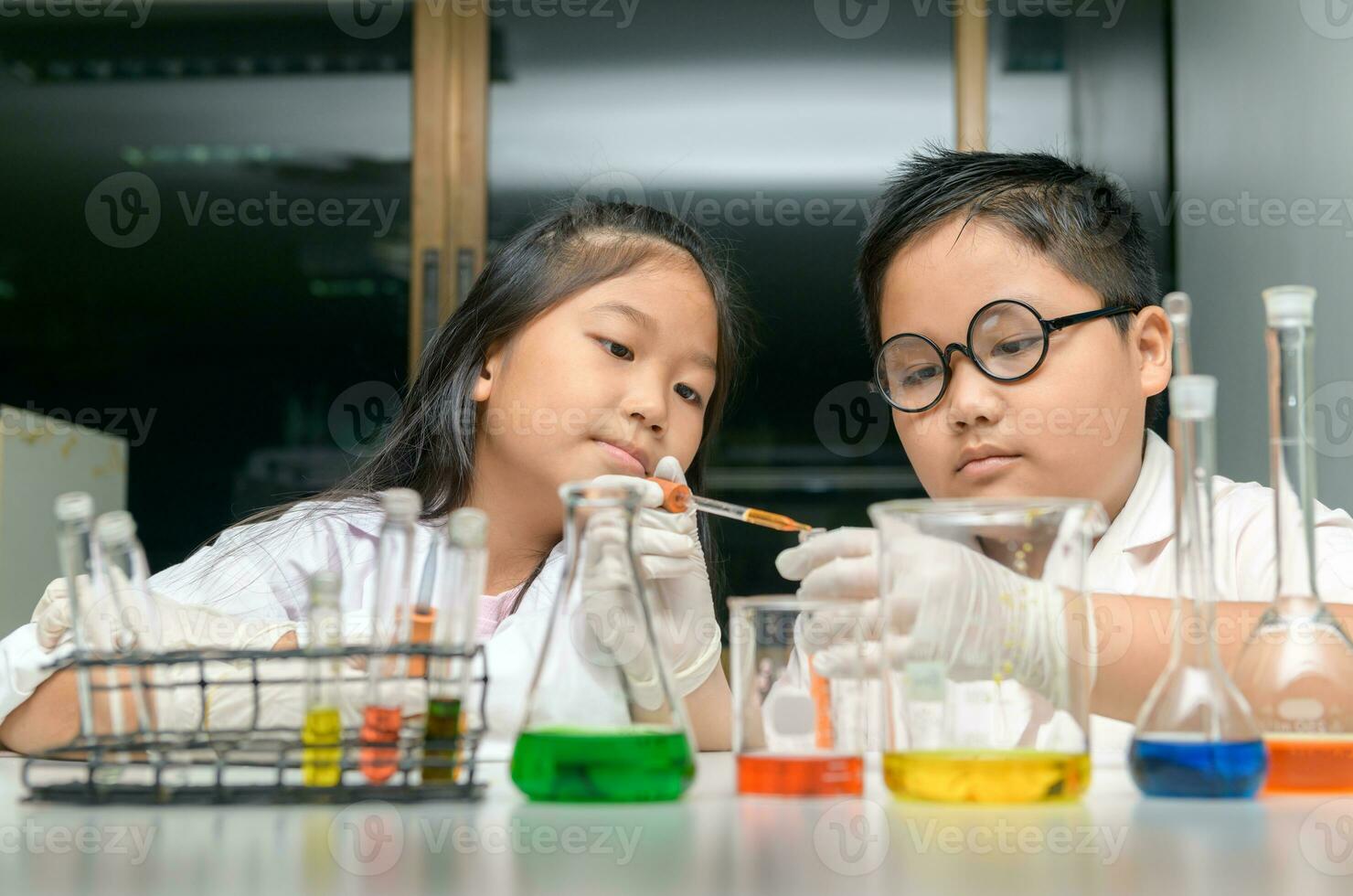 Happy two children making science experiments. photo