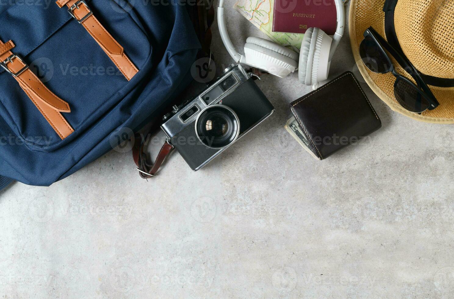 vintage backpack and vintage camera on marble photo