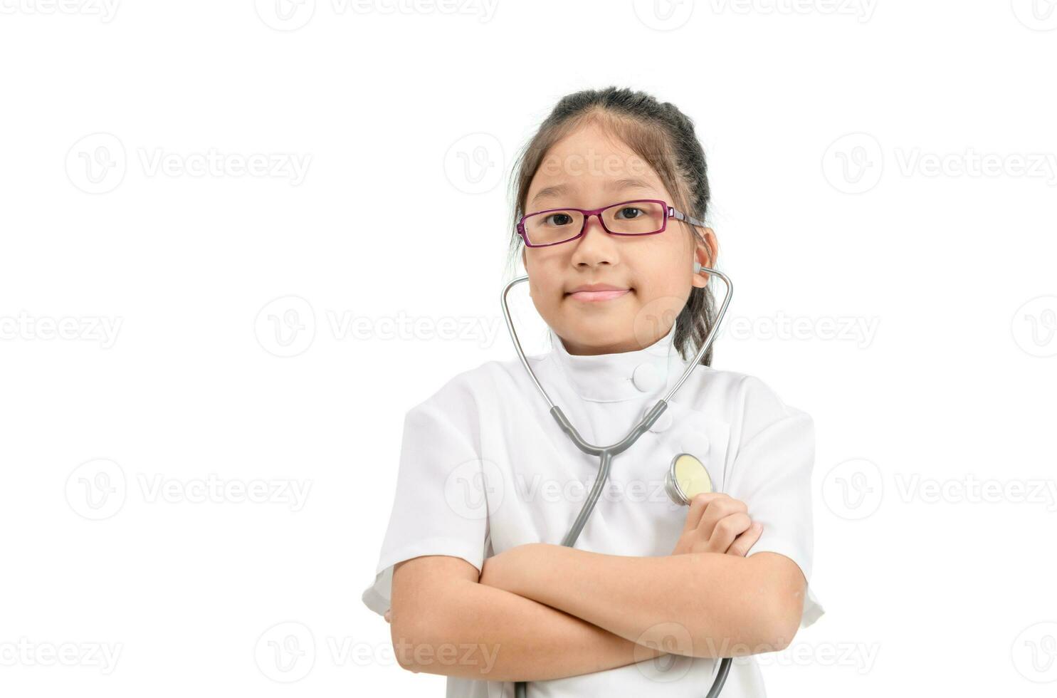 Cute asian child in doctor coat with stethoscope isolated photo