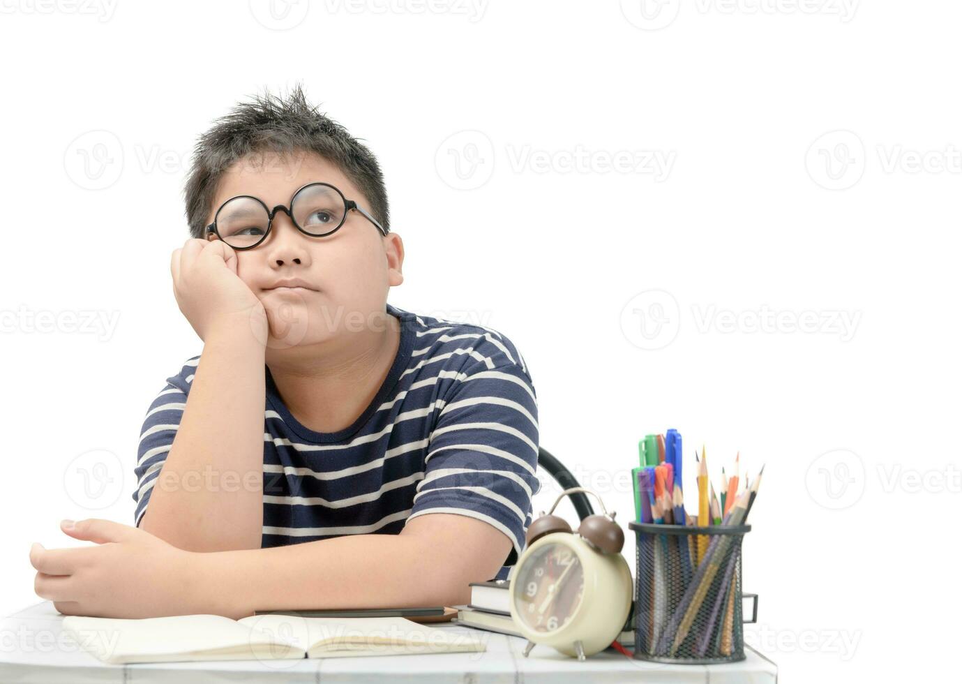 fat student thinking while doing his homework photo