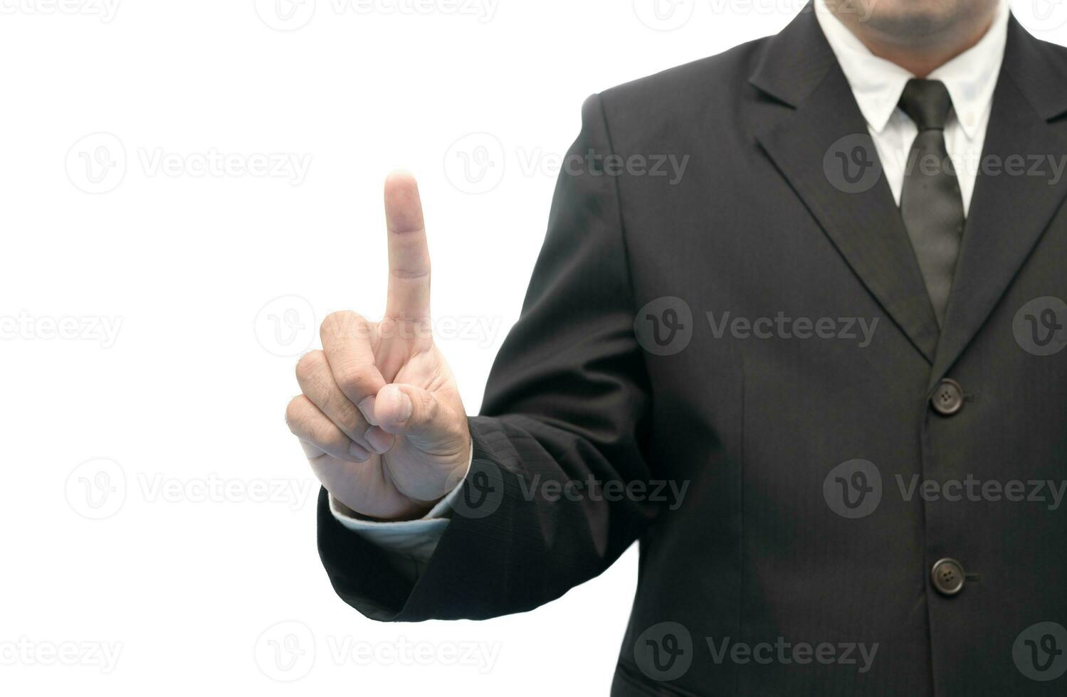 Young executive man touching an imaginary screen photo