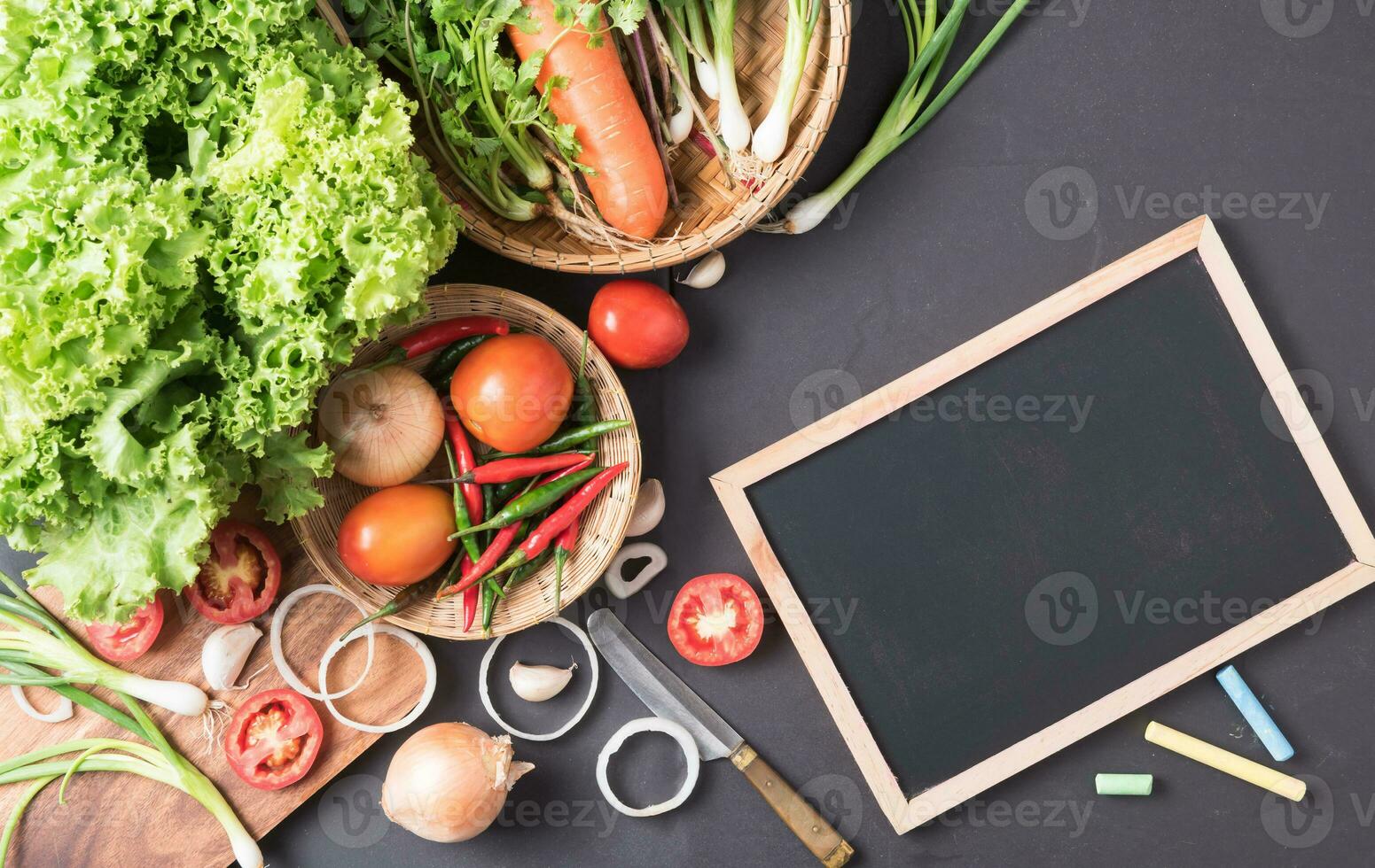 mix vegetable with blackboard on black background photo