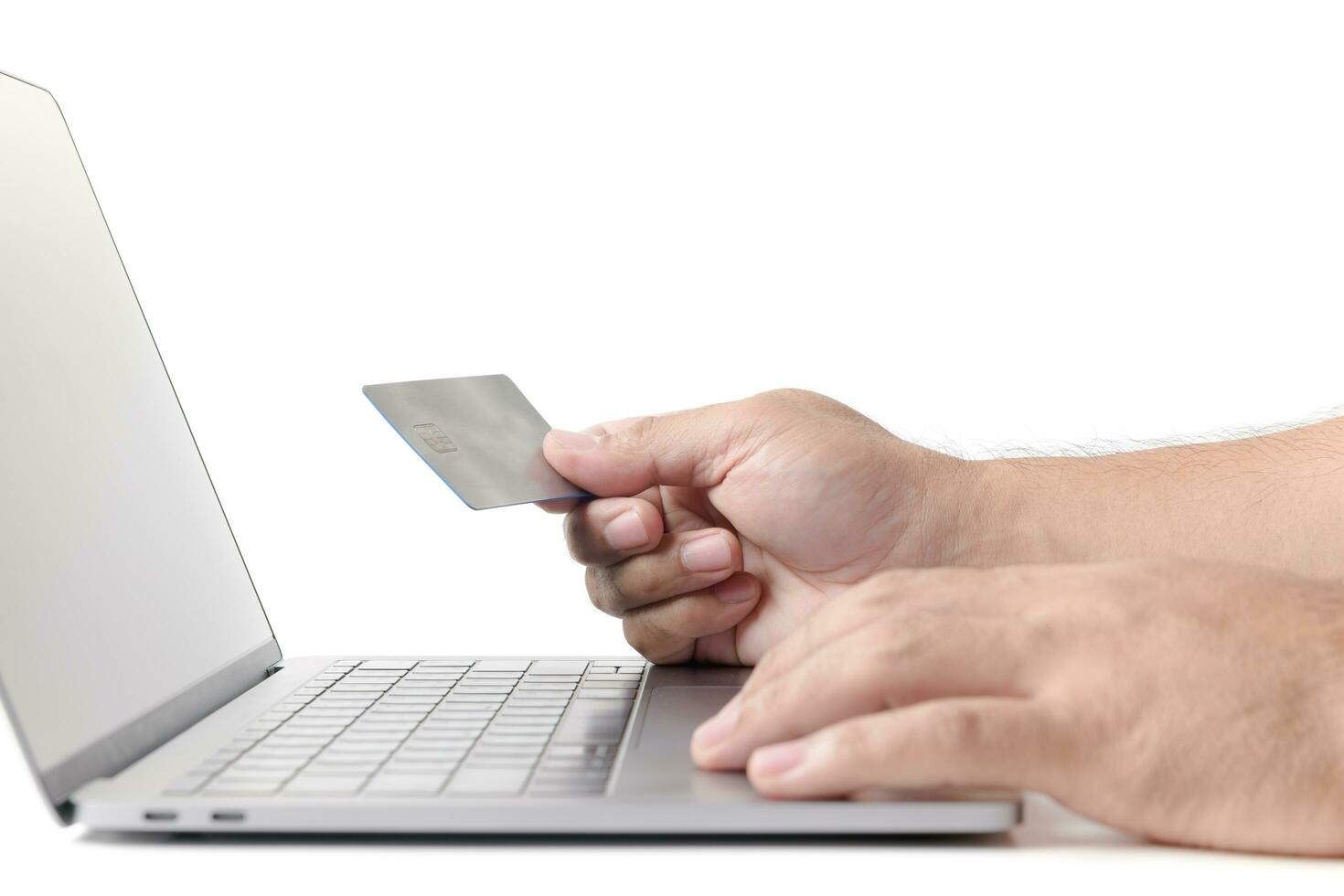 Man holding credit card   on laptop isolated e concept photo
