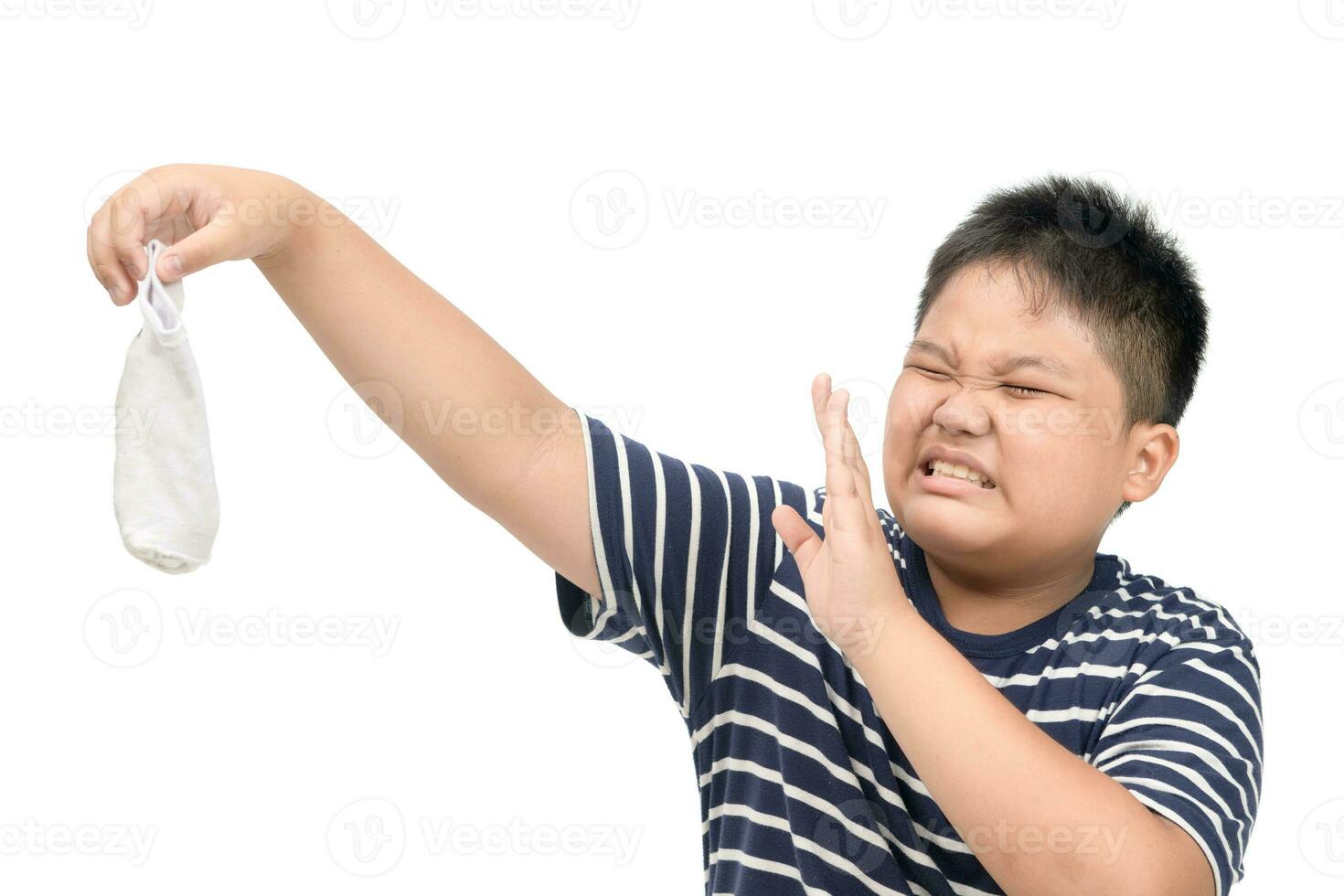 Fat boy holding dirty stinky socks isolated photo