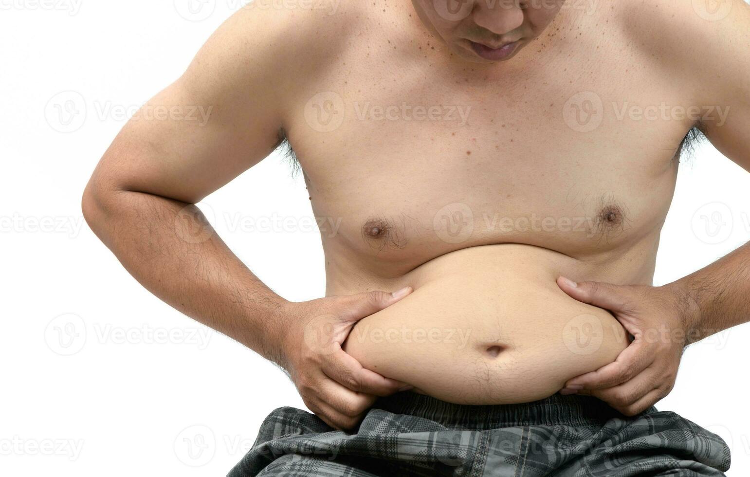 Obese man checking out his weight isolated photo