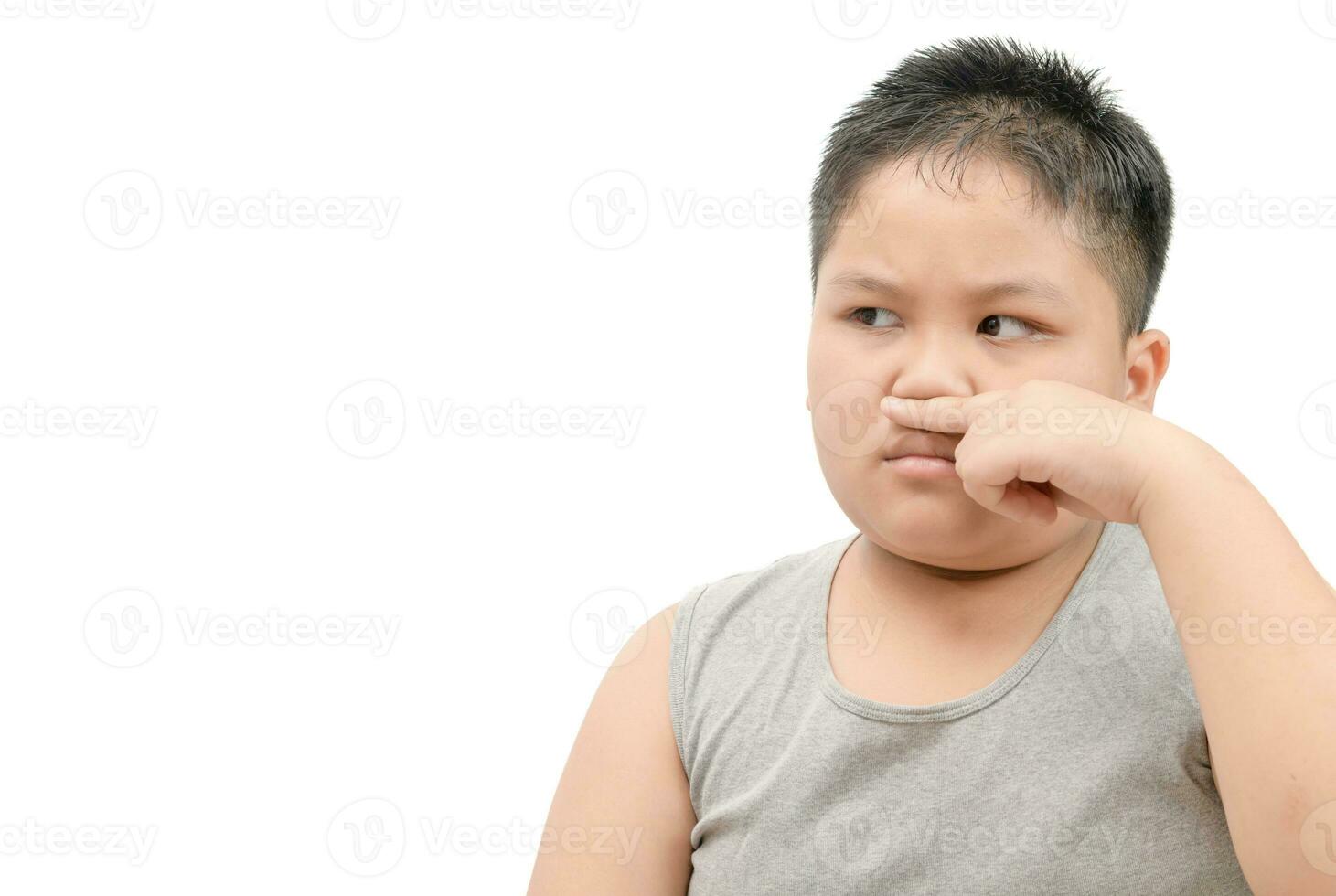 Fat boy covering his nose because of a bad foul smell photo