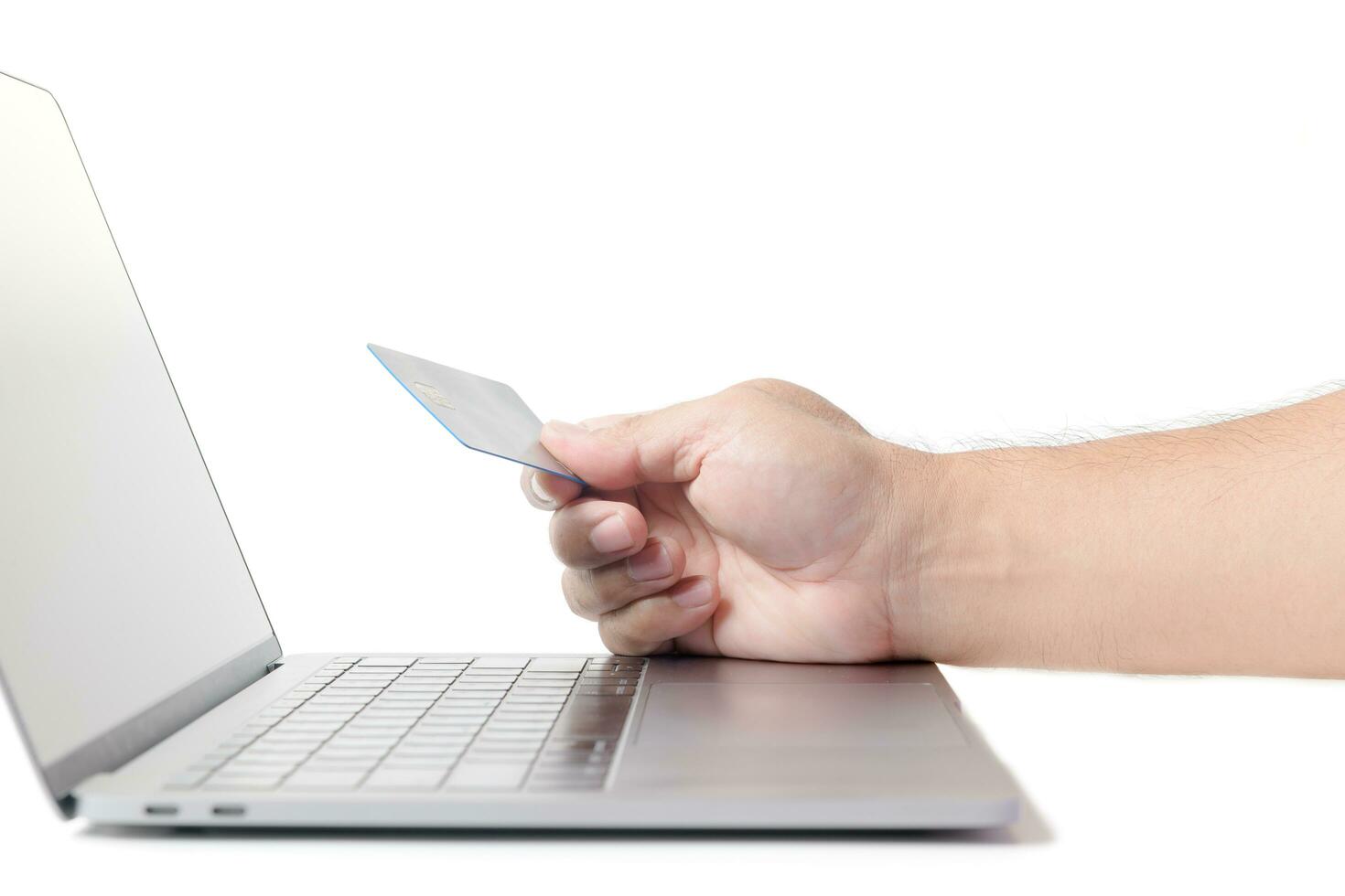 Man holding credit card   on laptop isolated e concept photo