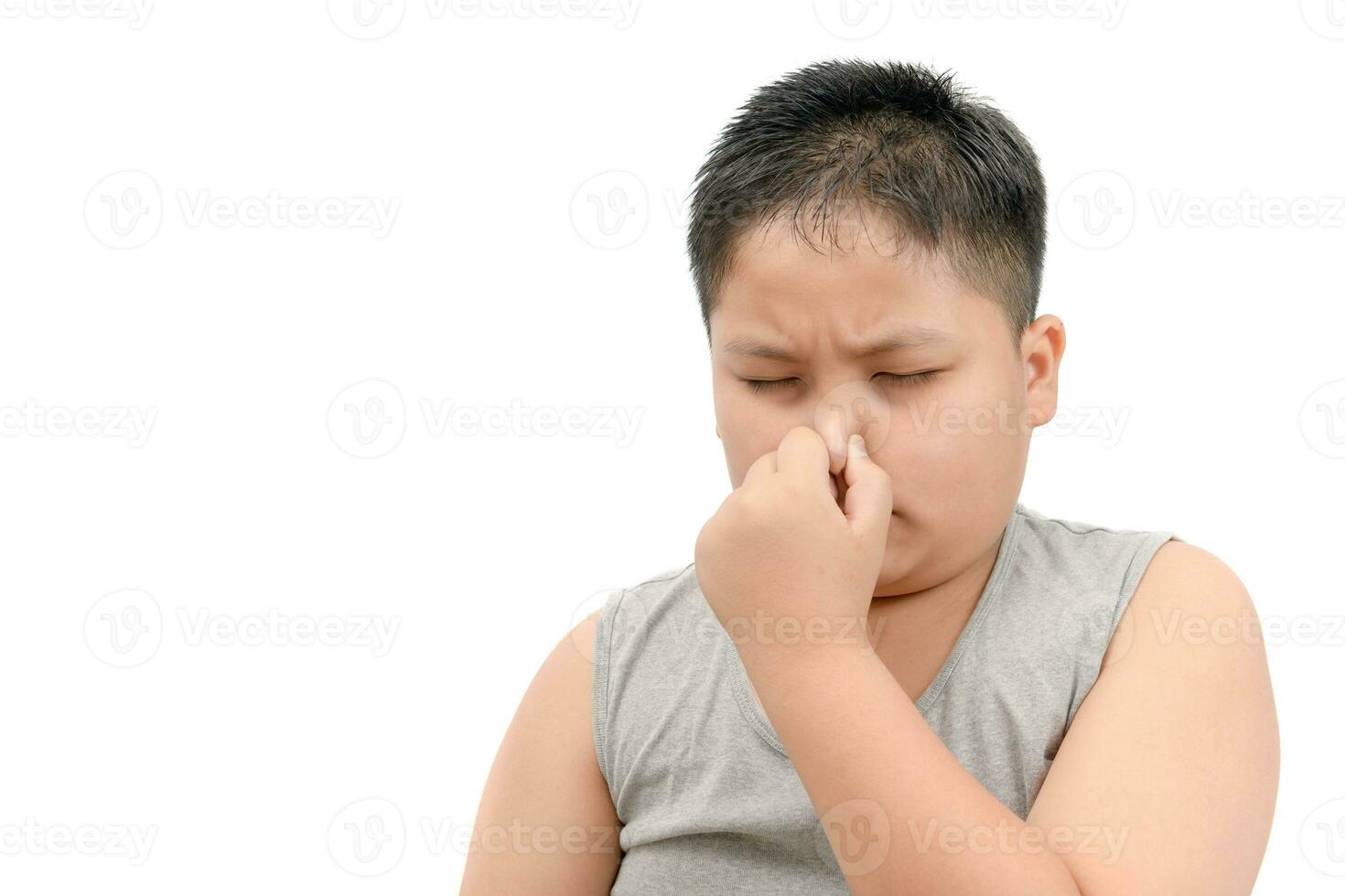 Fat boy covering his nose because of a bad foul smell photo