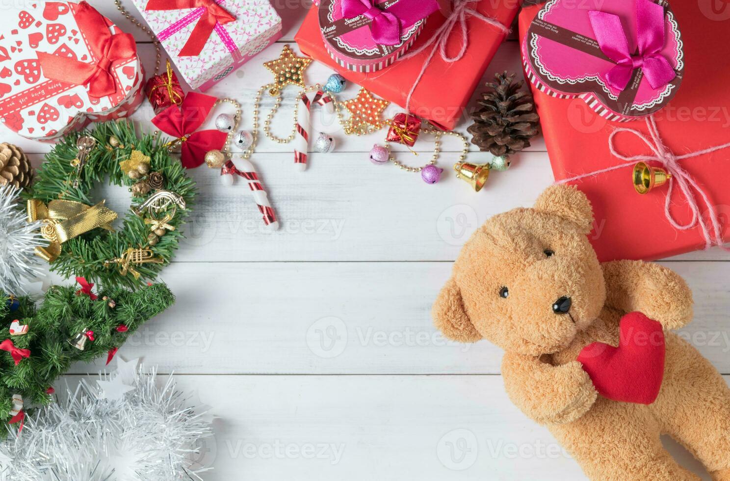 teddy bear doll and gift box on white wood background, photo