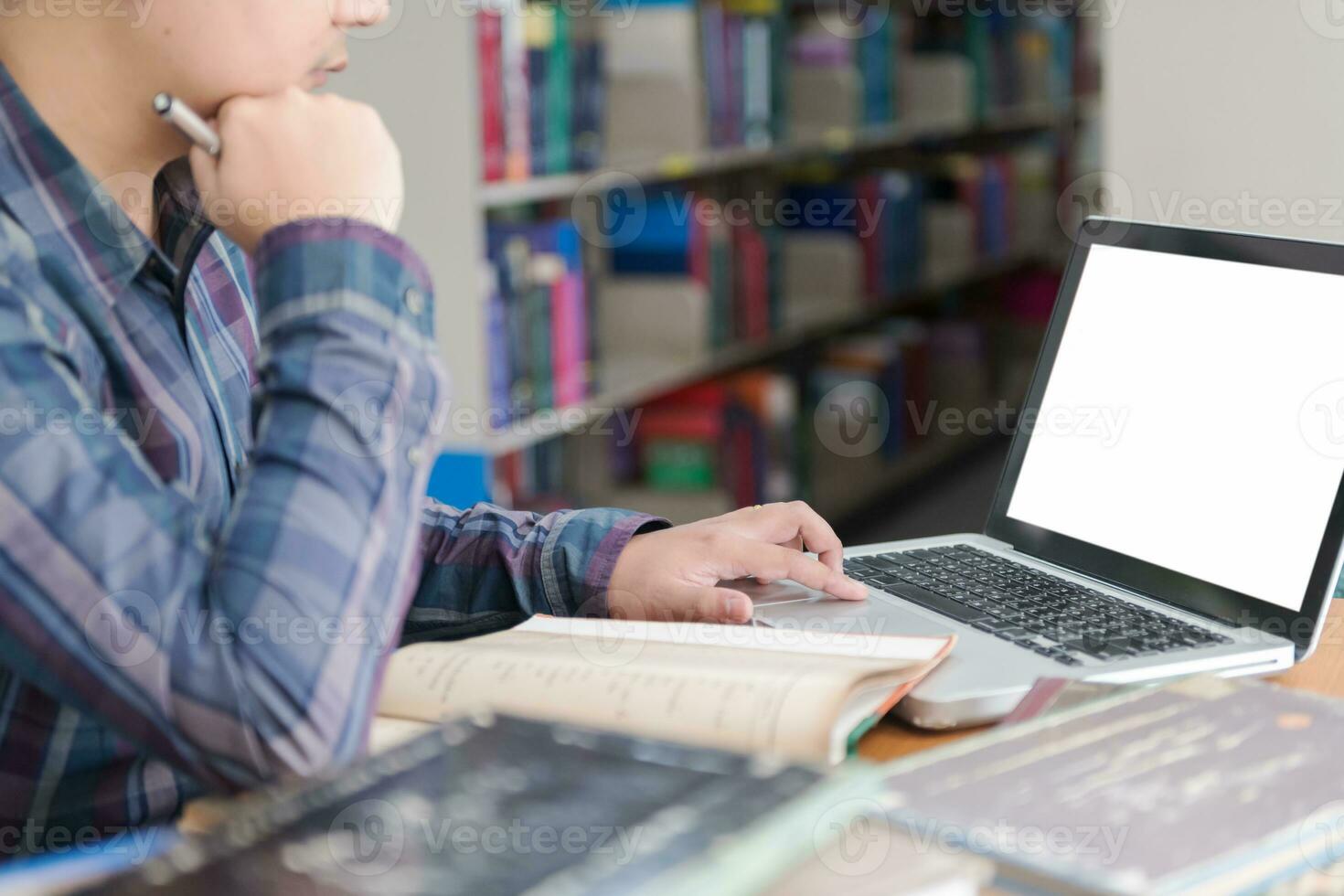 student preparing exam and learning lessons in school library, photo