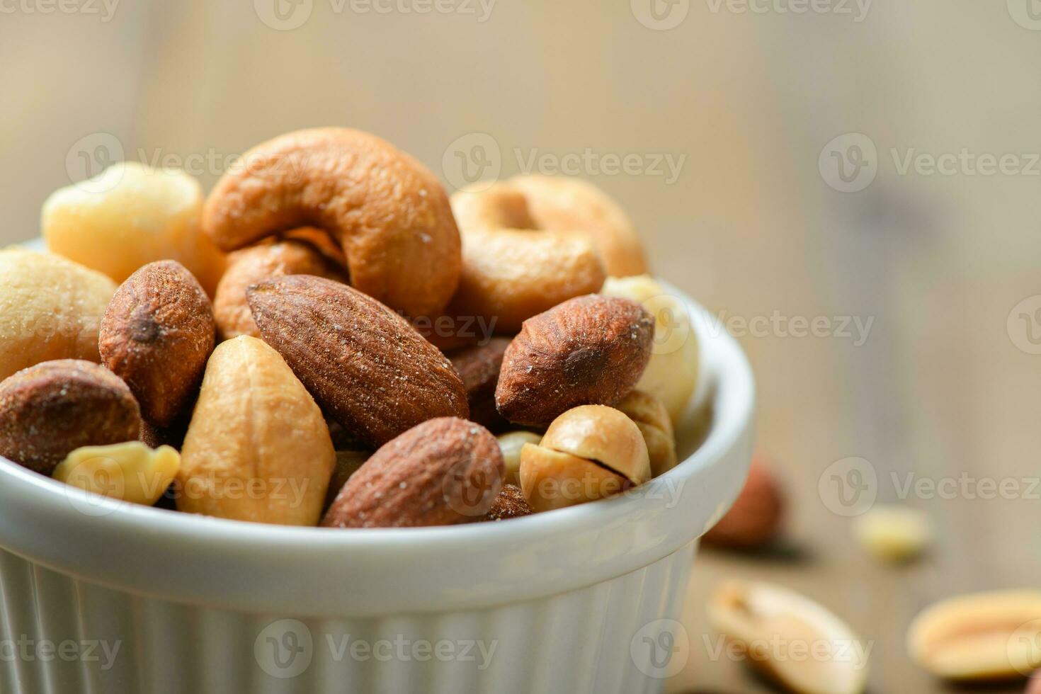 Closed up of salted cocktail nuts in cup photo