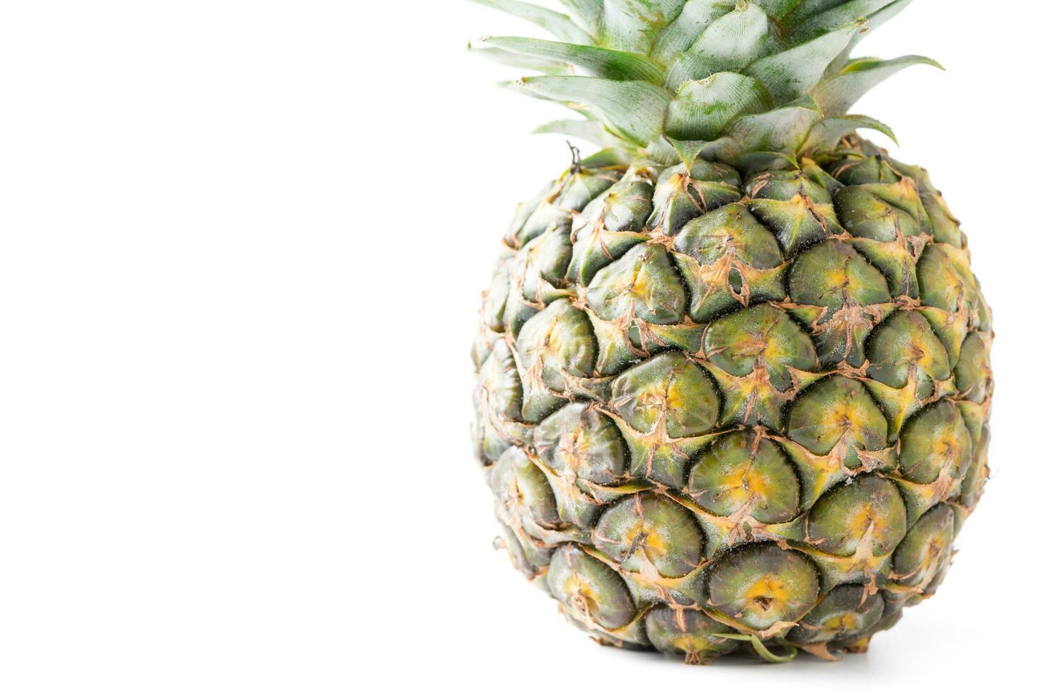 Closed up of fresh pineapple isolated on white photo