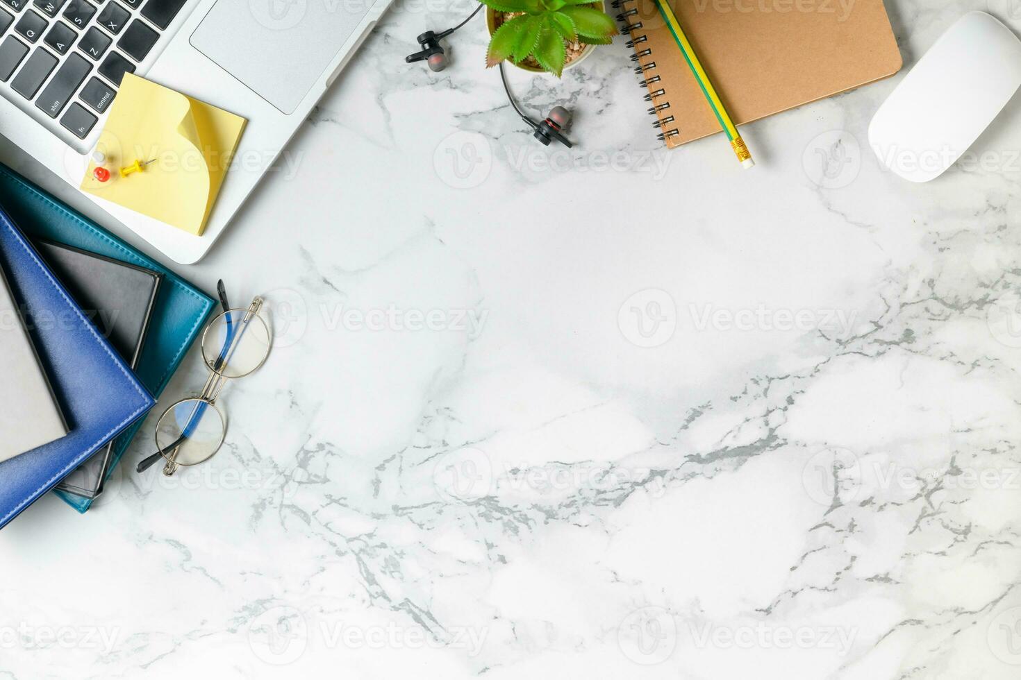 Modern marble desk table with laptop, other supplies photo