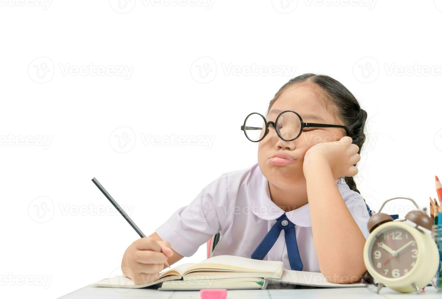 Bored and tired girl doing homework photo
