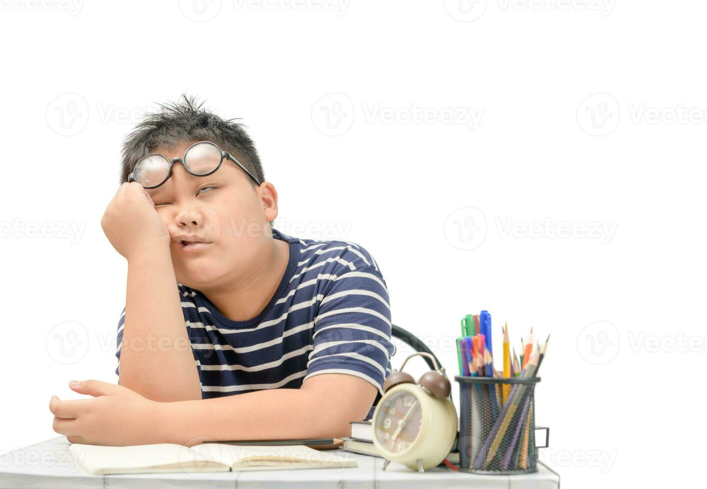 Bored and tired asian student doing homework i photo