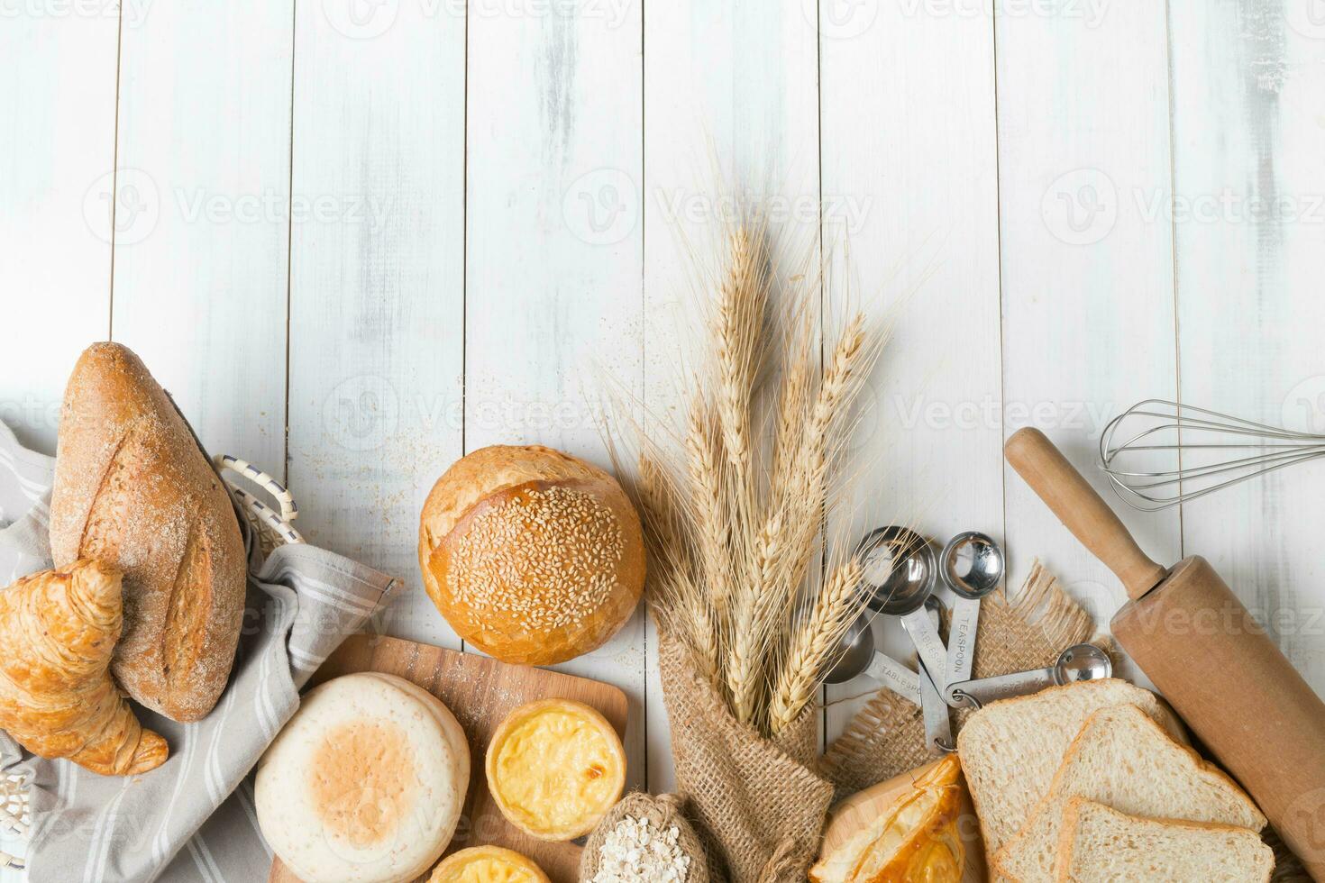 mix bread and bakery on white wood background photo