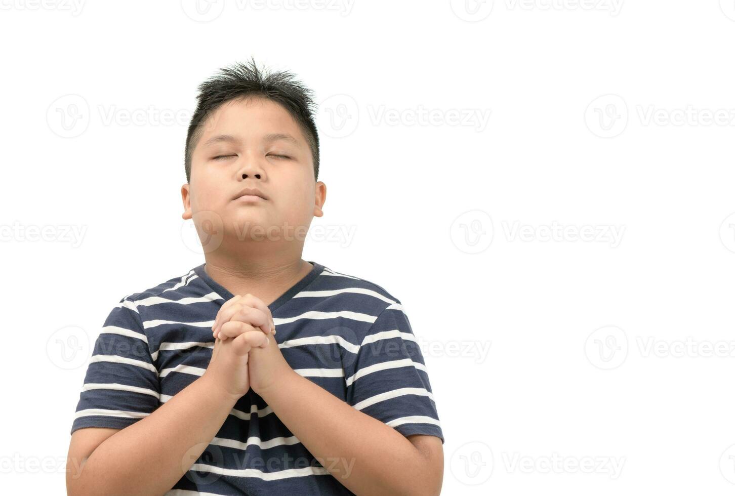 Asian boy praying isolated on white photo